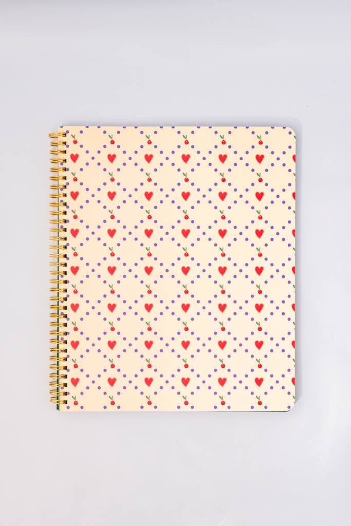 Notebook with heart pattern and cherries on a light gray background
