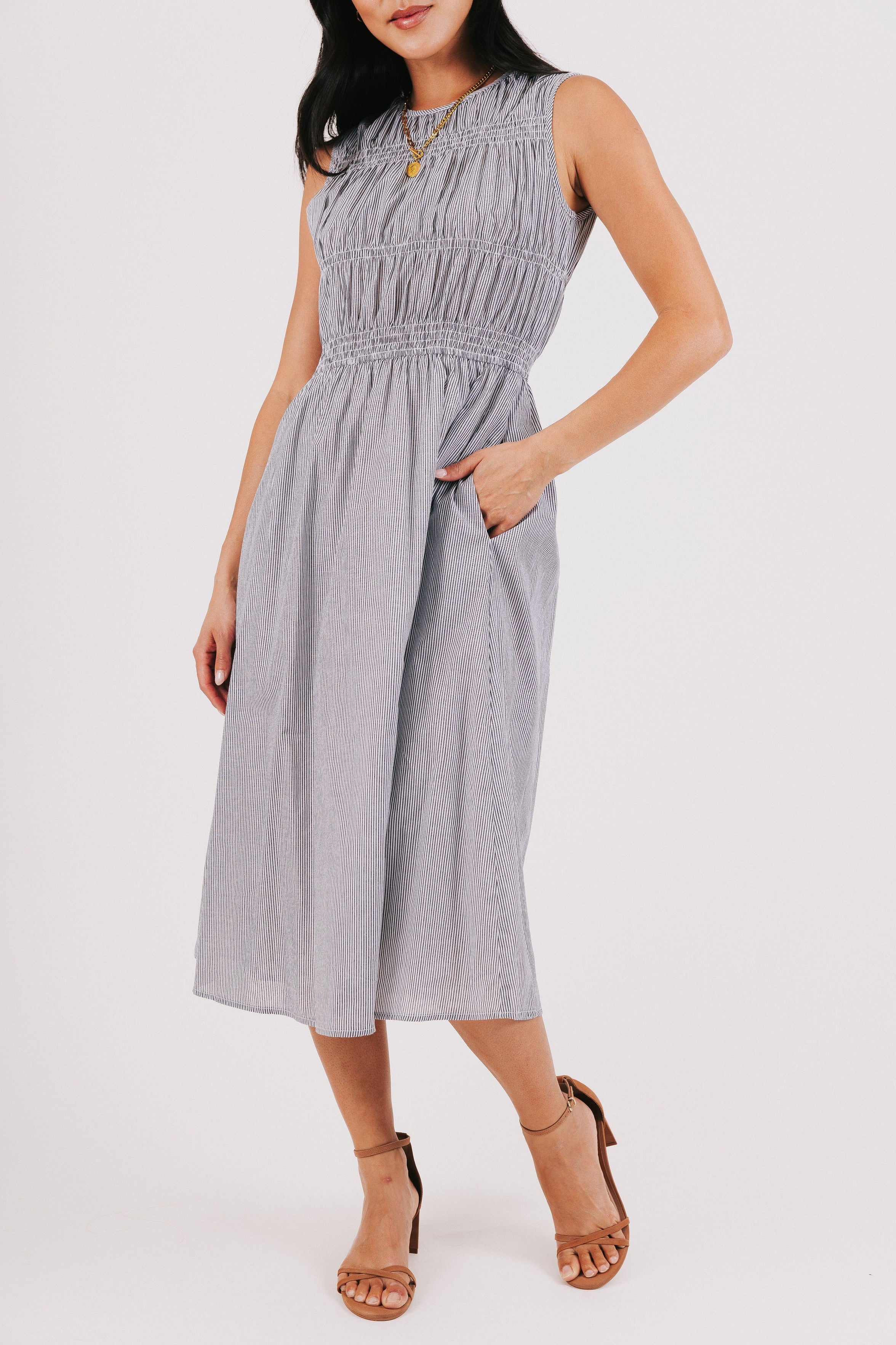 black and white striped midi dress with smocked bodice