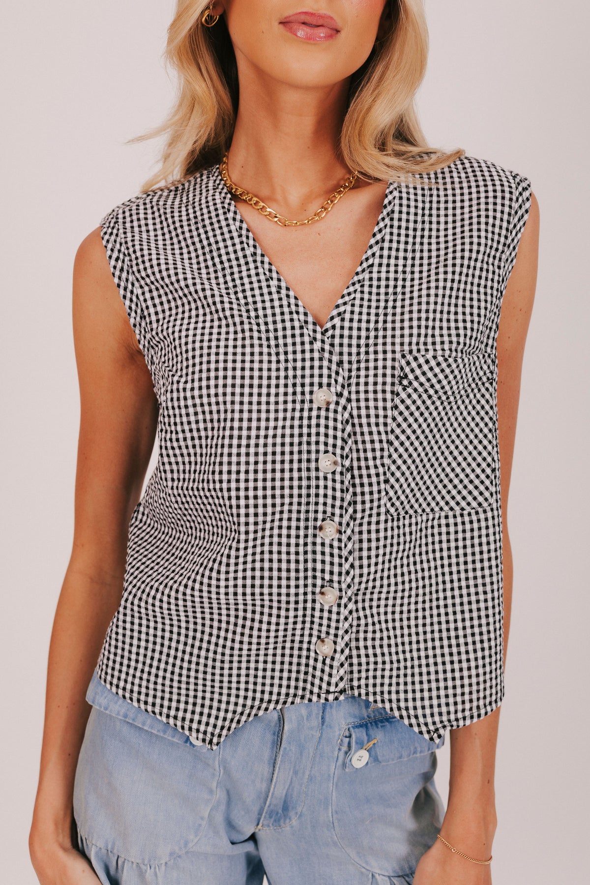 Black and white gingham top with button down front and front pocket