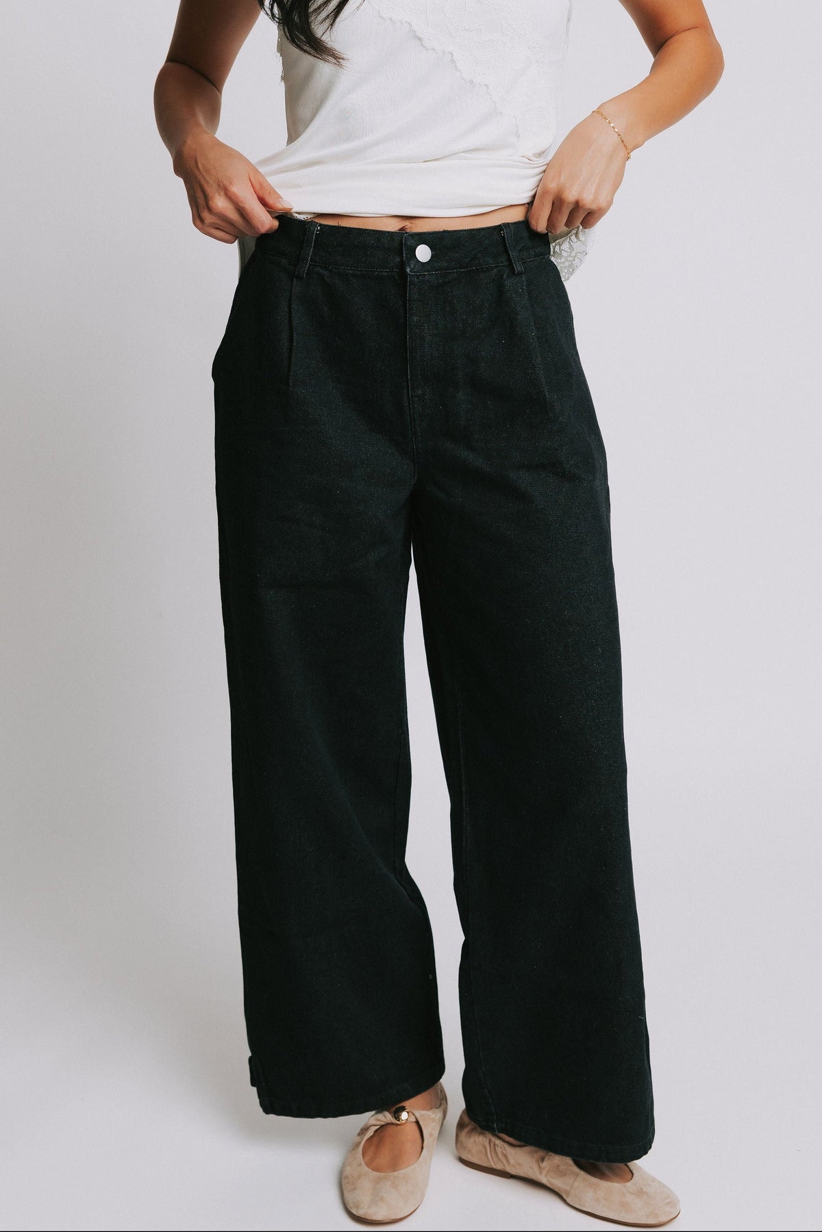 black wide leg jeans with snap adjustments