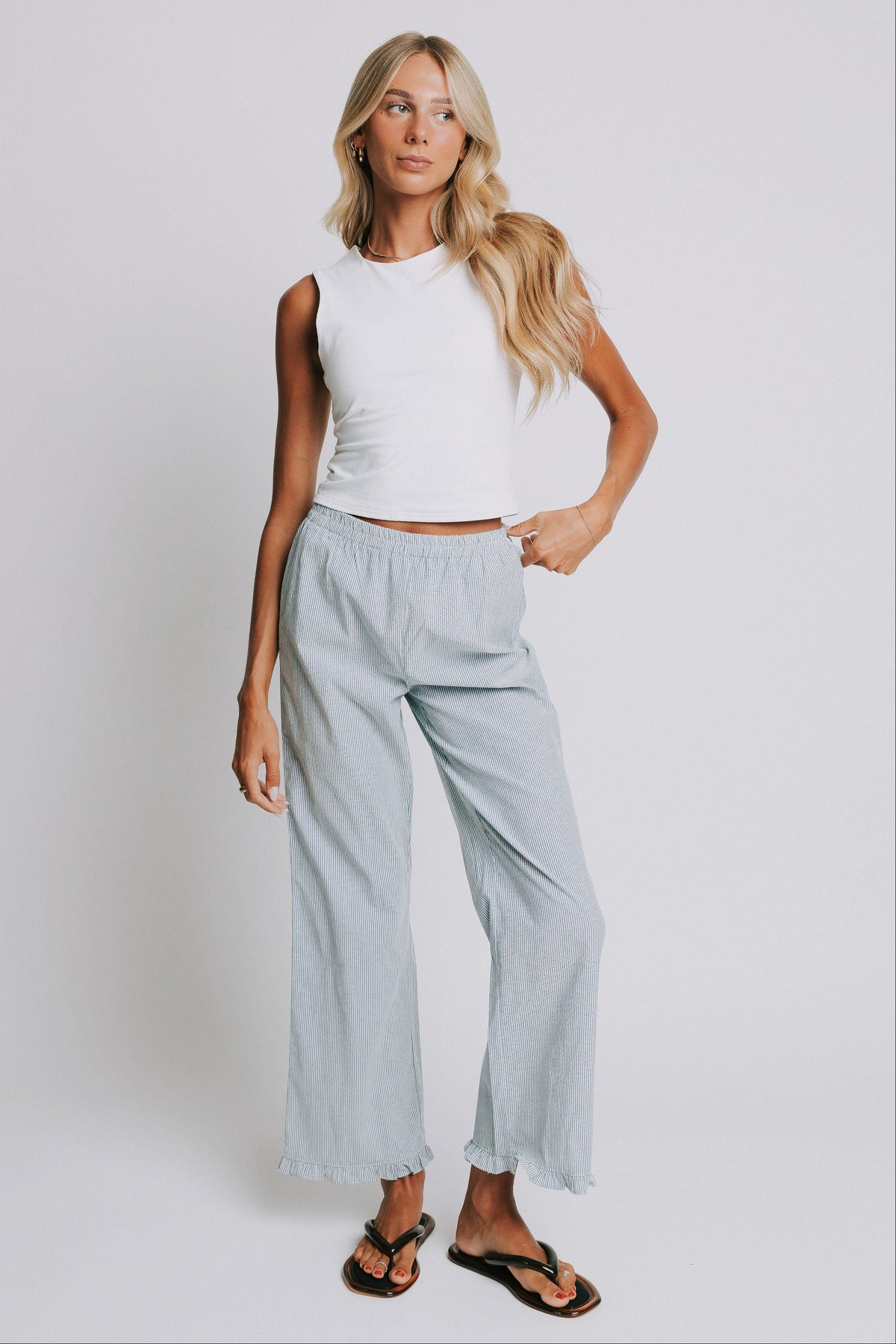 blue and white striped pants with elastic waist and ruffled hem