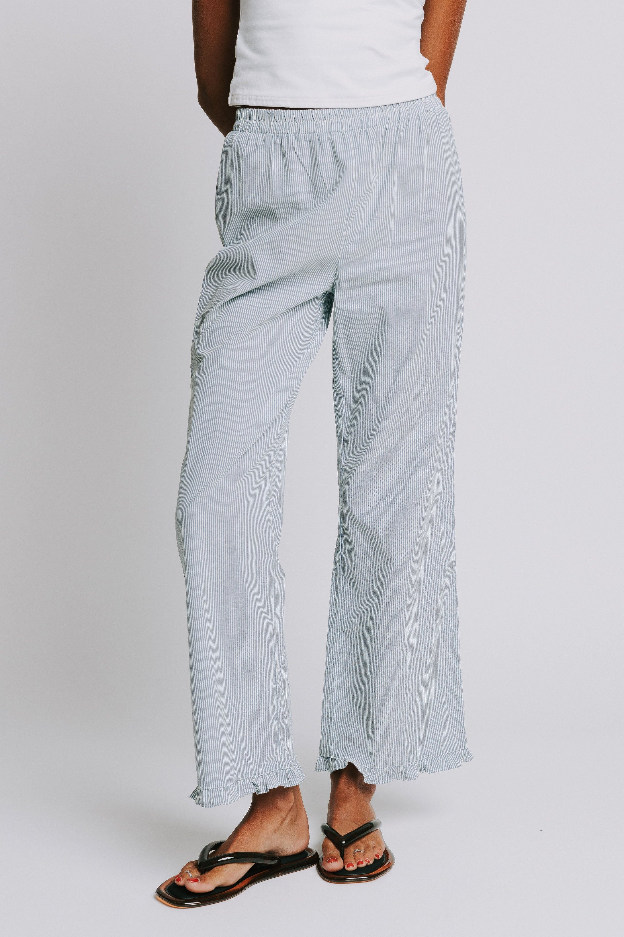 blue and white striped pants with elastic waist and ruffled hem