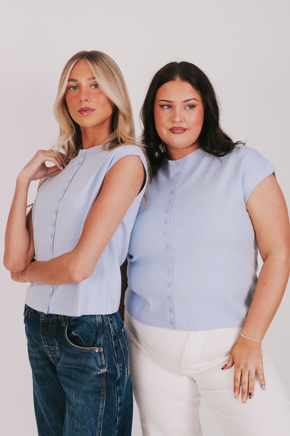 blue top with cap sleeves and buttons down the front