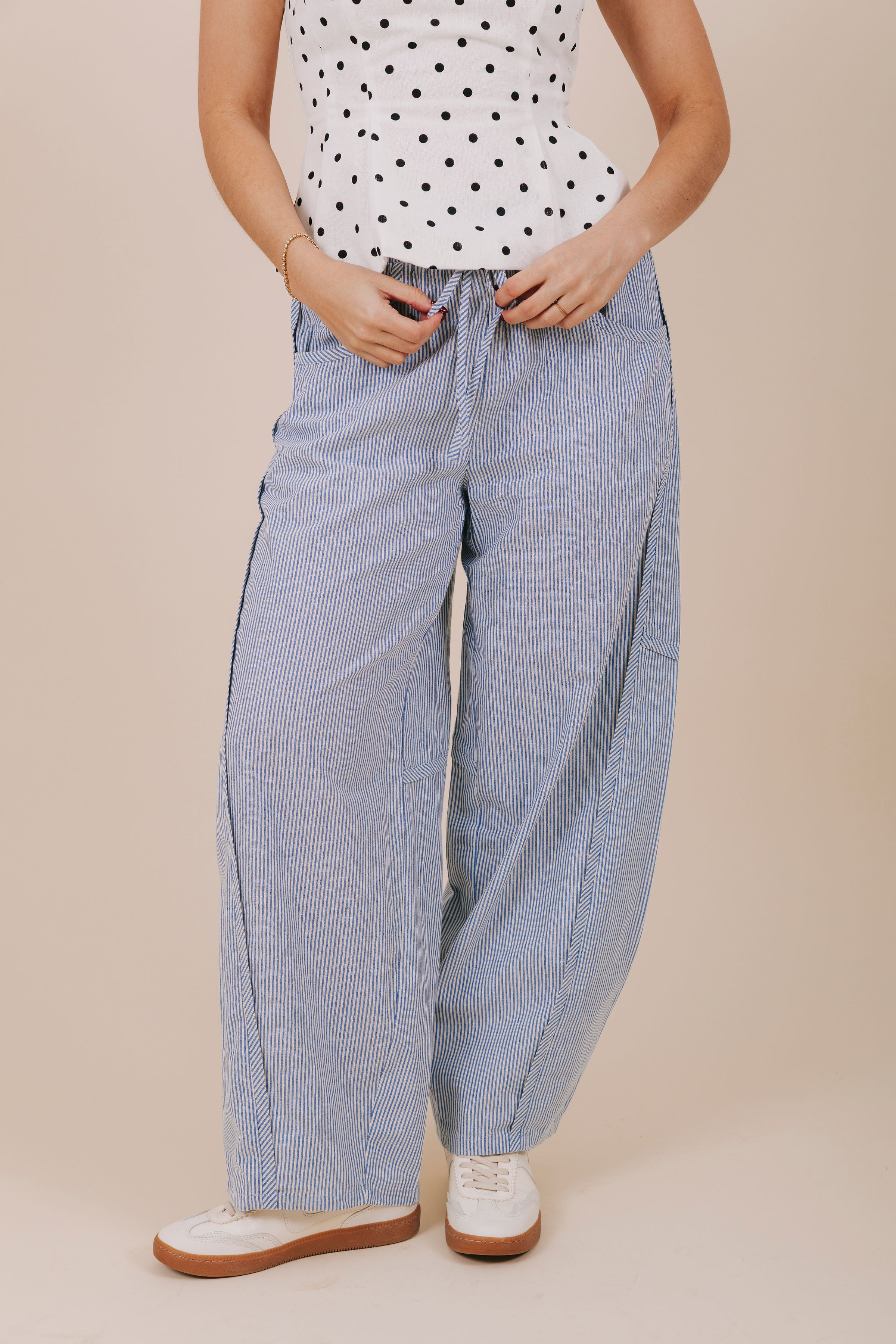 blue vertical stripe barrel cut pants front