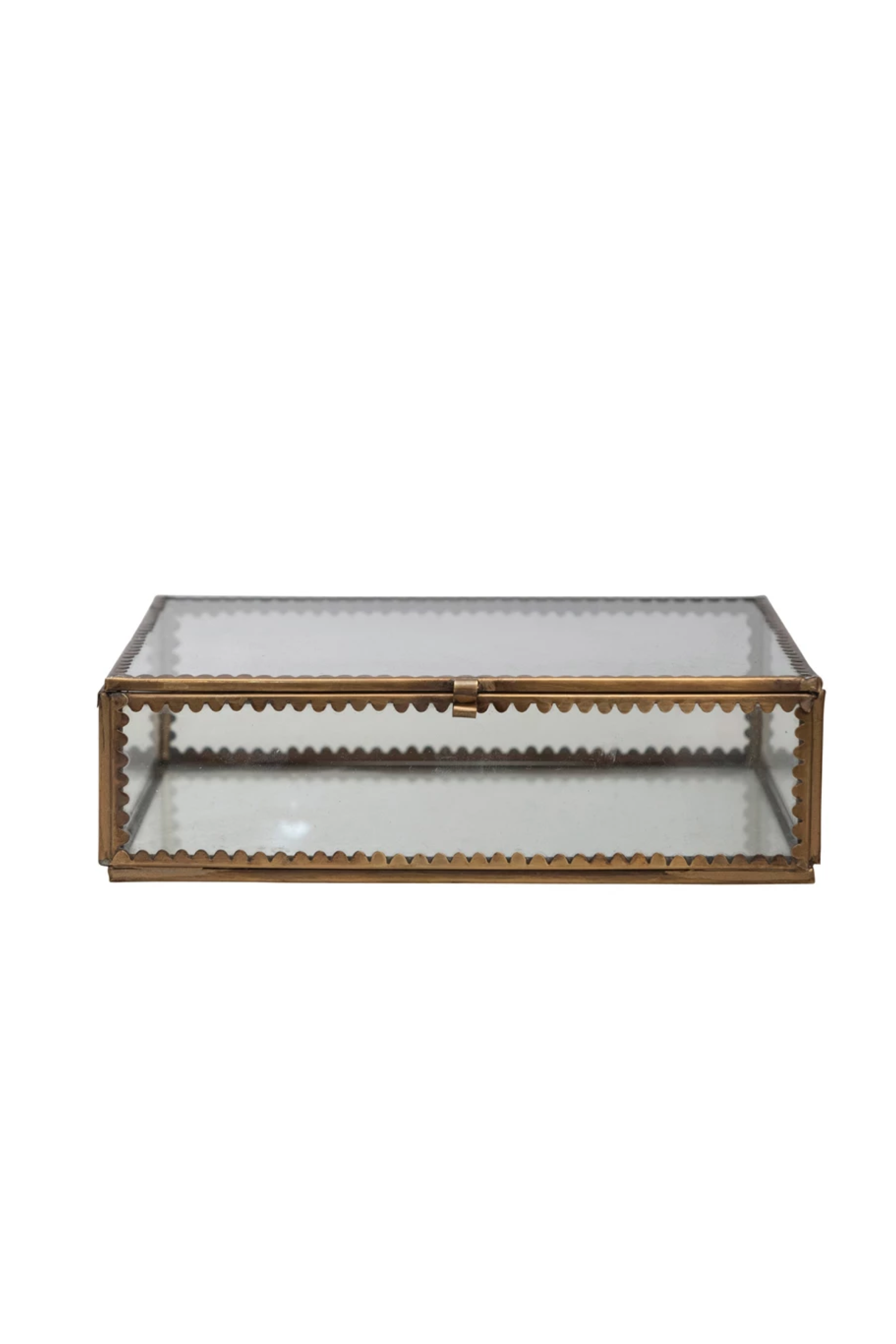 A brass and glass display box with scalloped edges