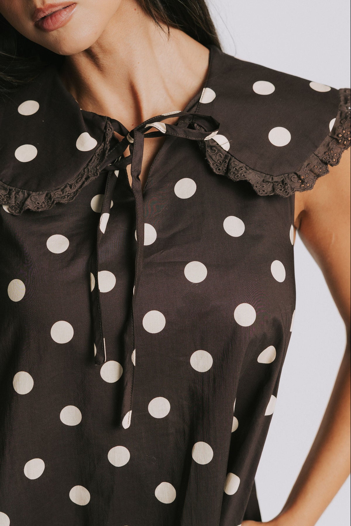 brown polka dot mini dress with a wide collar front