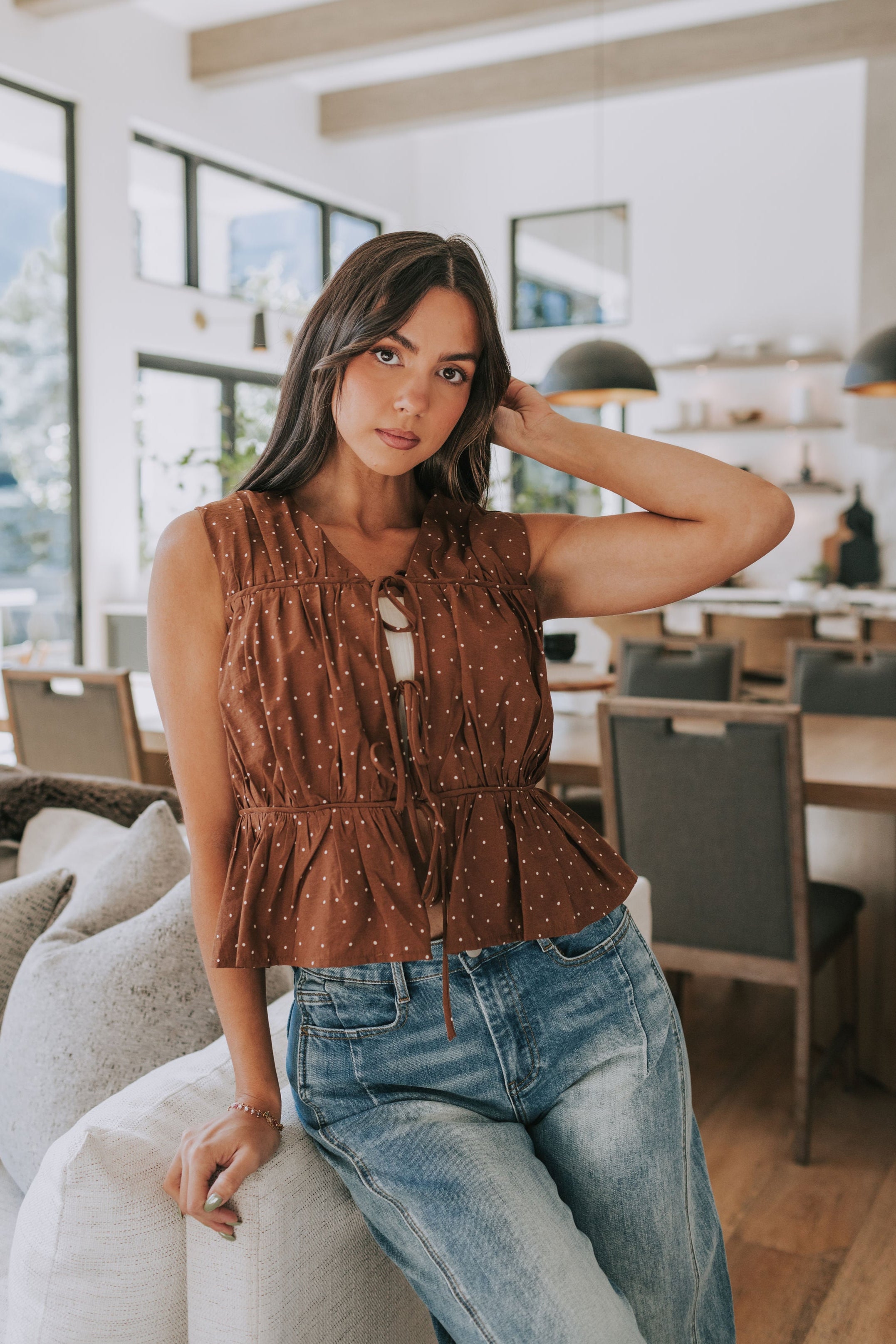 Brown top/vest with white polka dots. sleeveless open front tied bows ruching and gathered