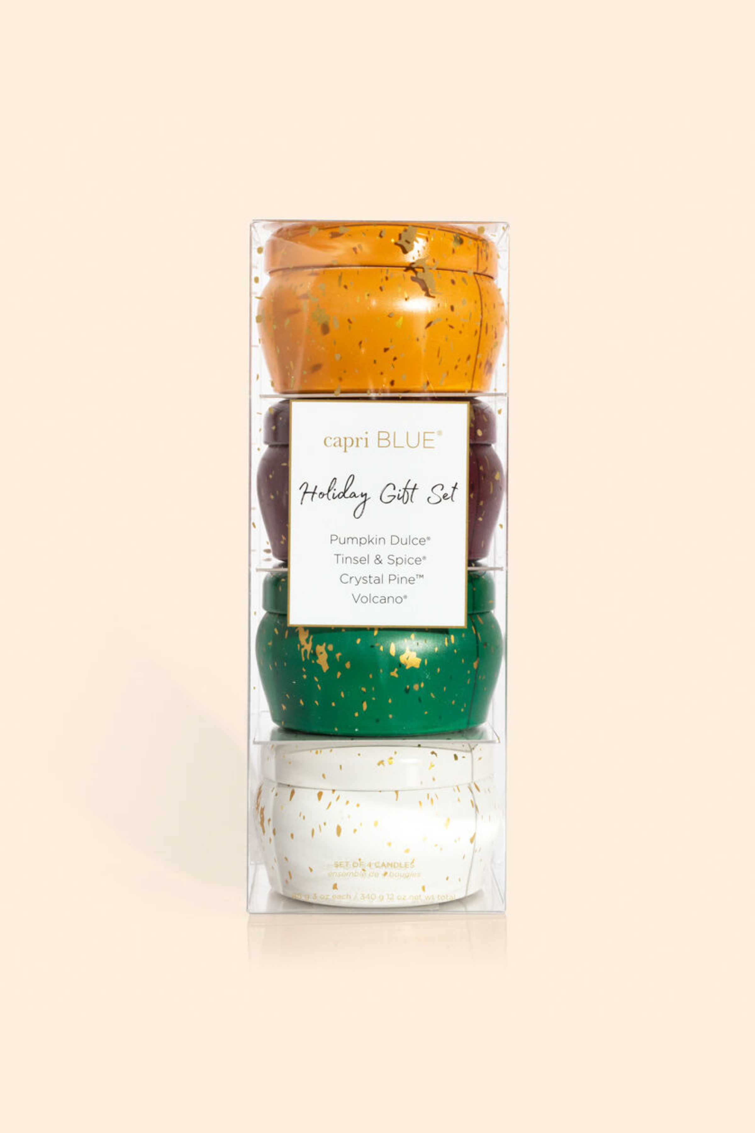 Set of four holiday candles in Pumpkin Dulce, Tinsel & Spice, Crystal Pine, and Volcano scents.