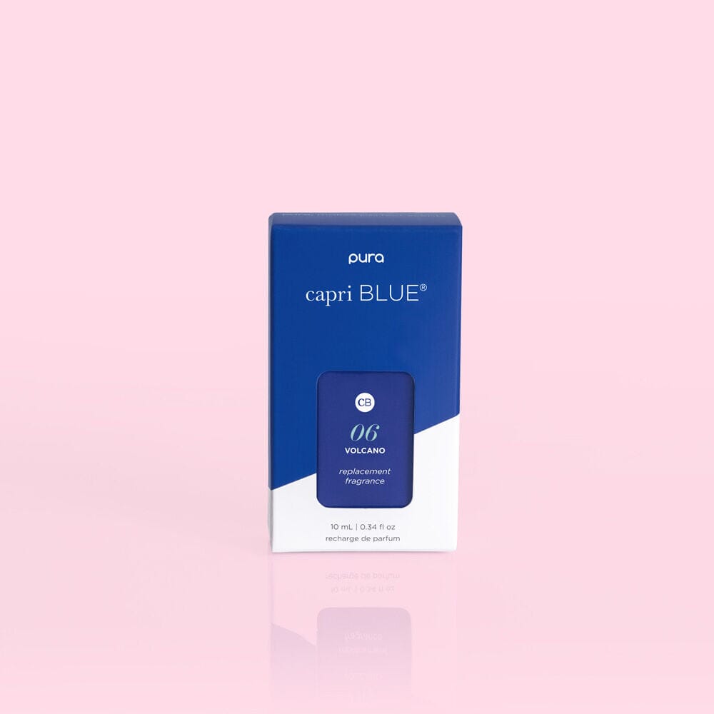 Pura capri blue replacement fragrance packaging on a pink background