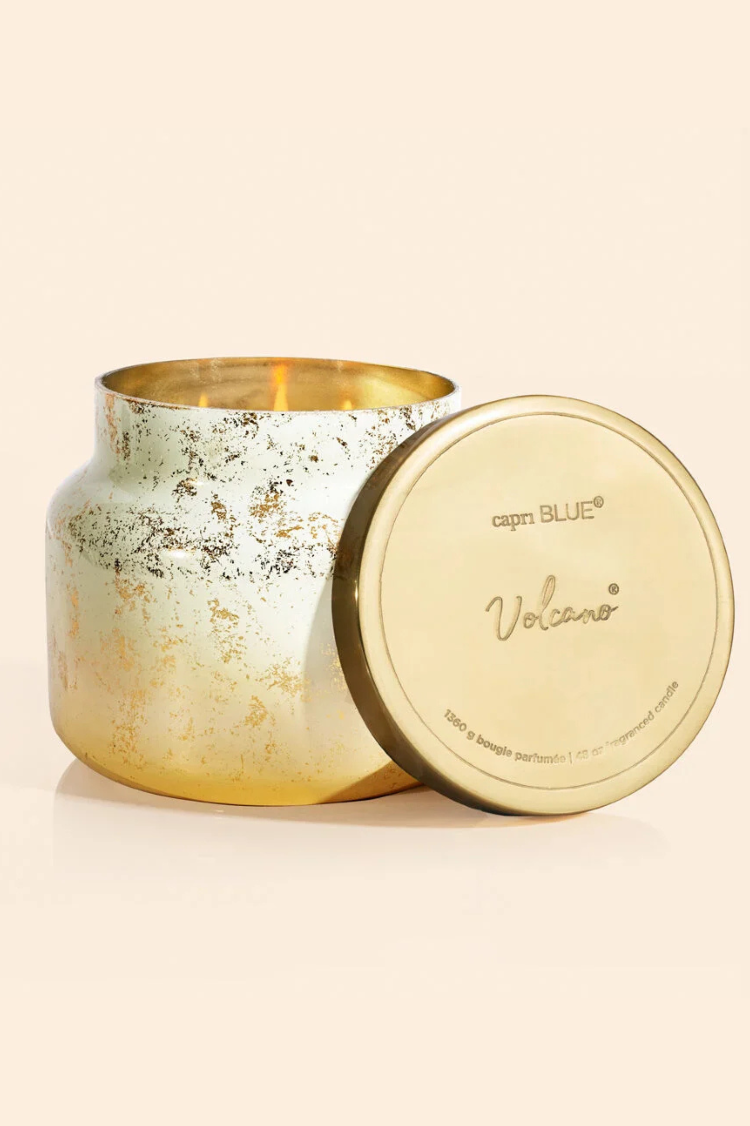 Candle jar with white to gold ombre with gold flecks and a brushed gold lid.