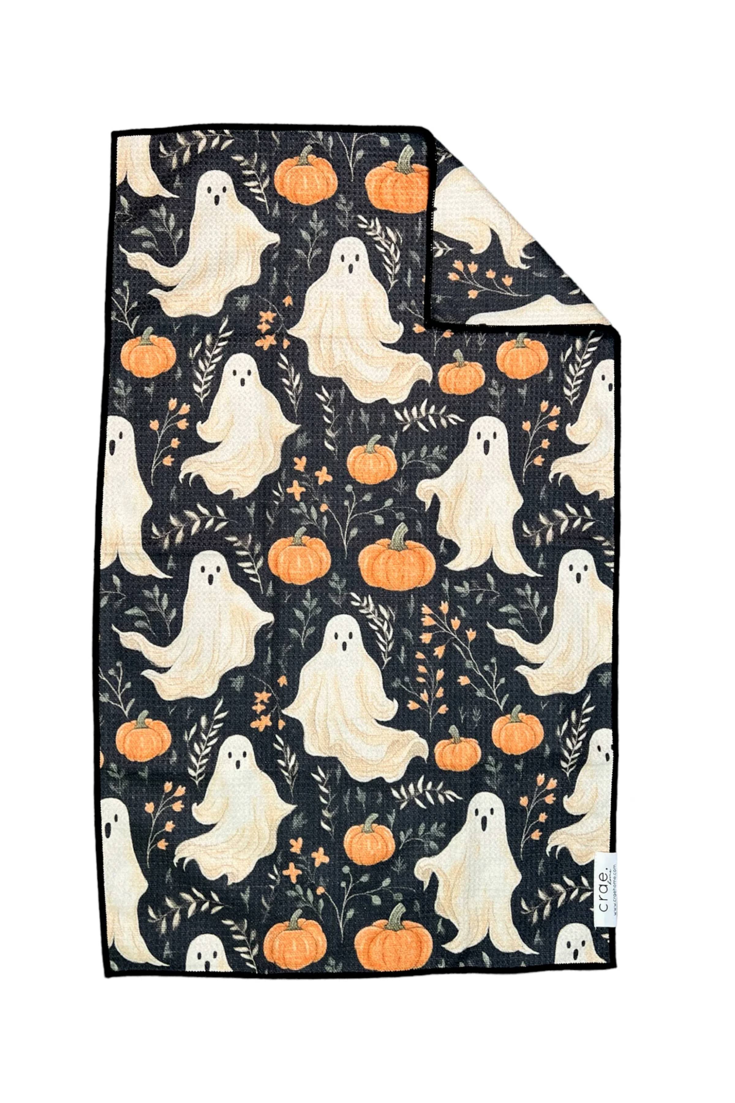 A double-sided microfiber kitchen towel with a Halloween theme, featuring ghosts and pumpkins on a black background.