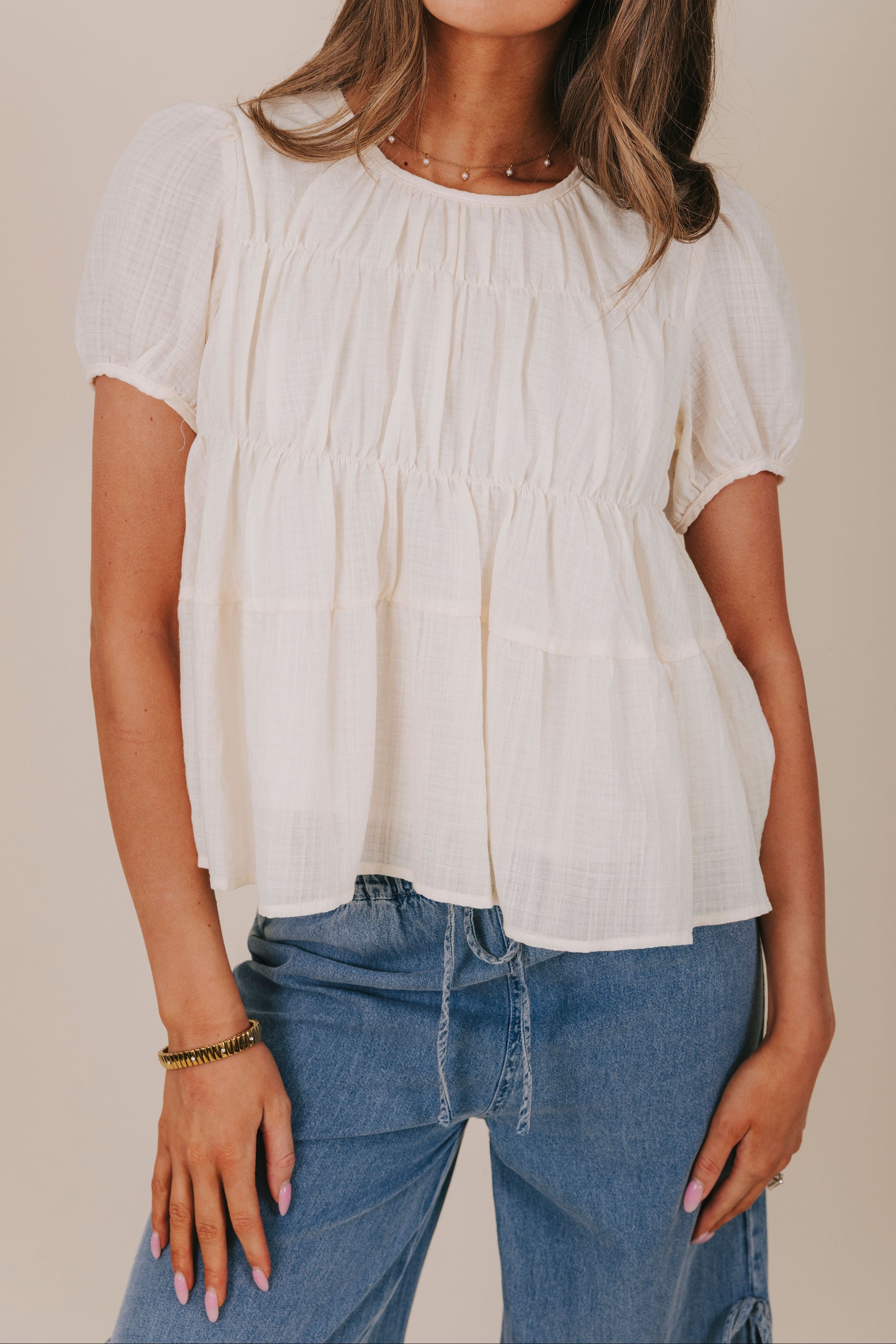 cream tiered ruched puff sleeves ties inclusive top detail
