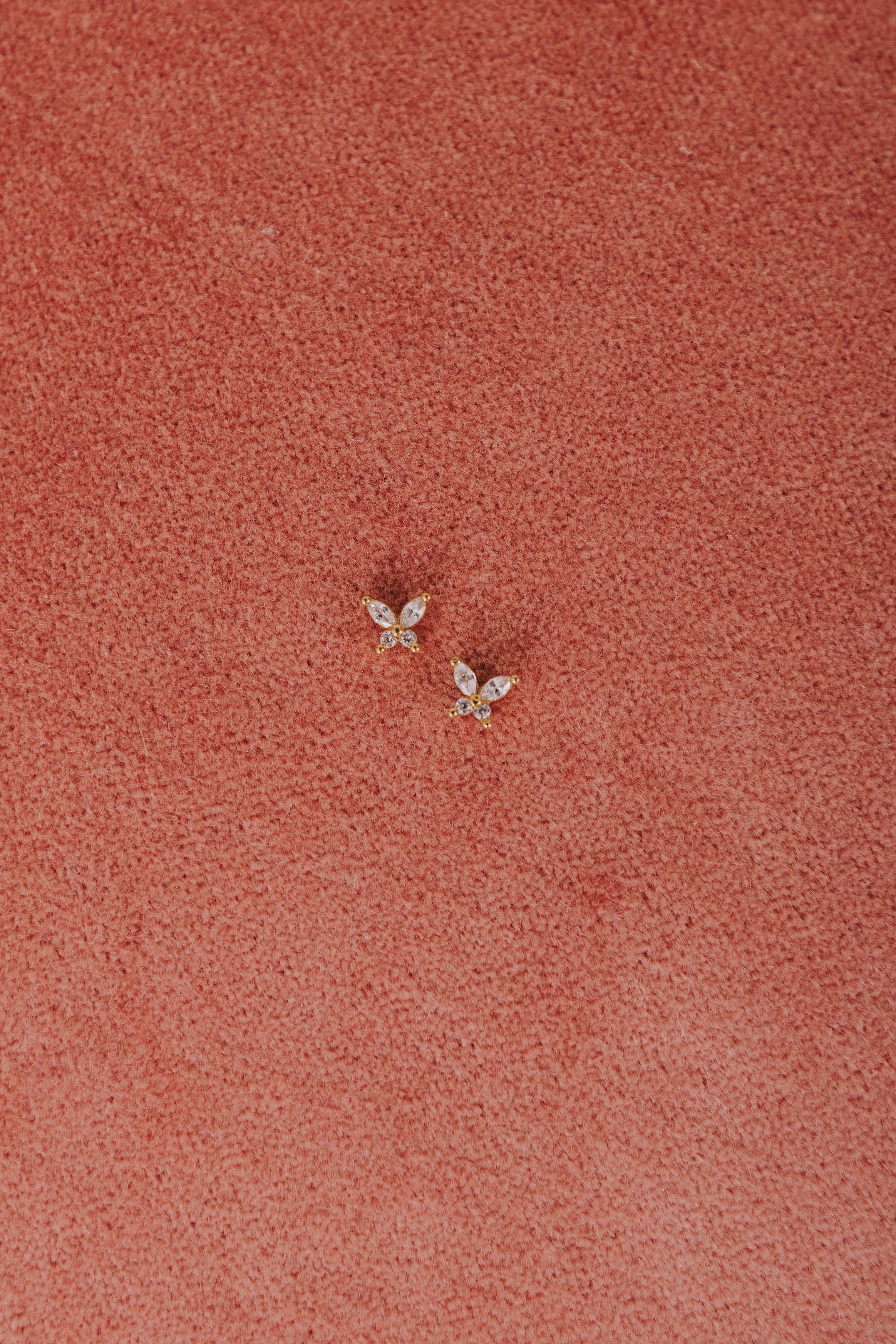 cubic zirconia butterfly earrings flatlay