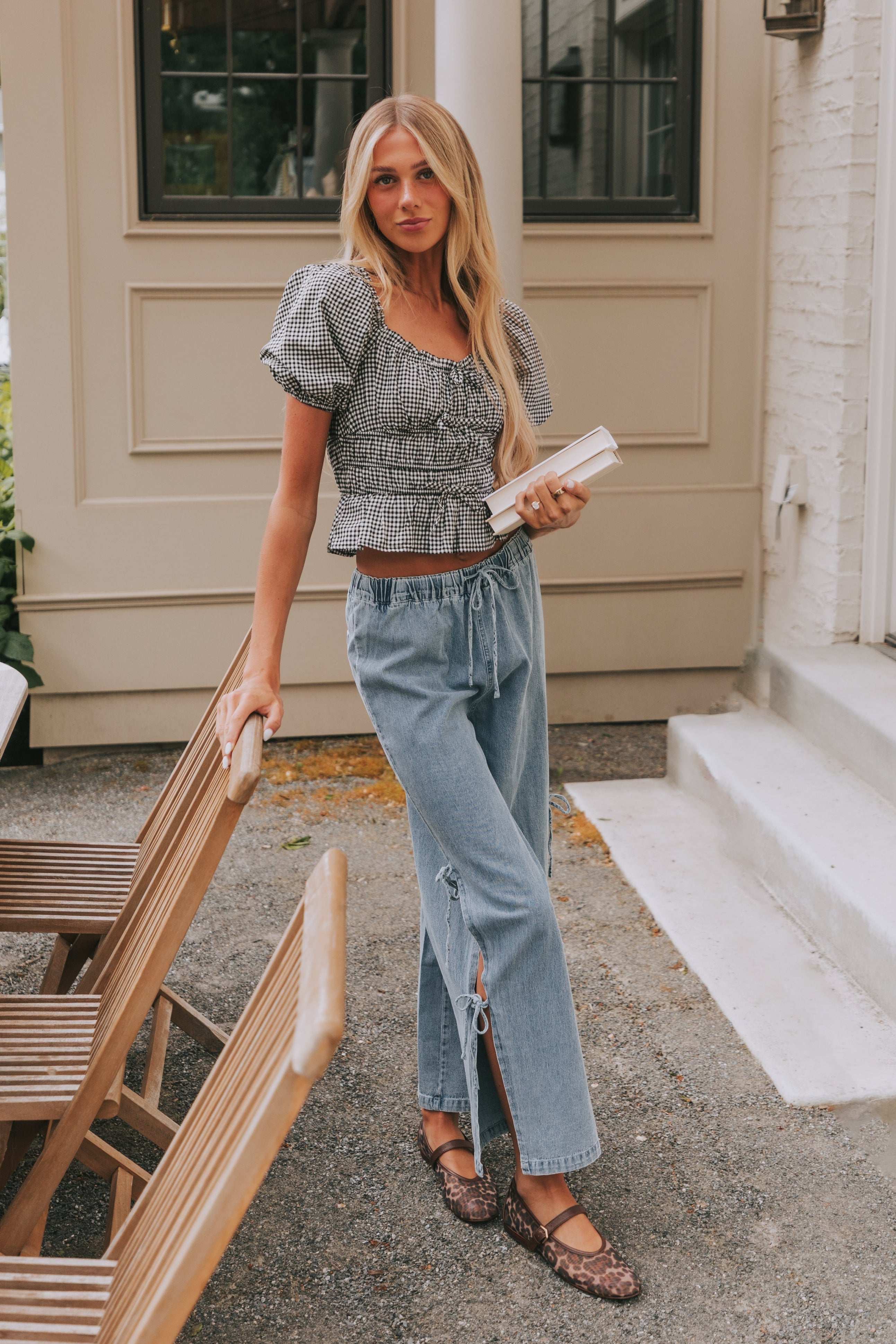 Wide leg jeans with elastic waistband and tied bow detailing. back pockets cute chic