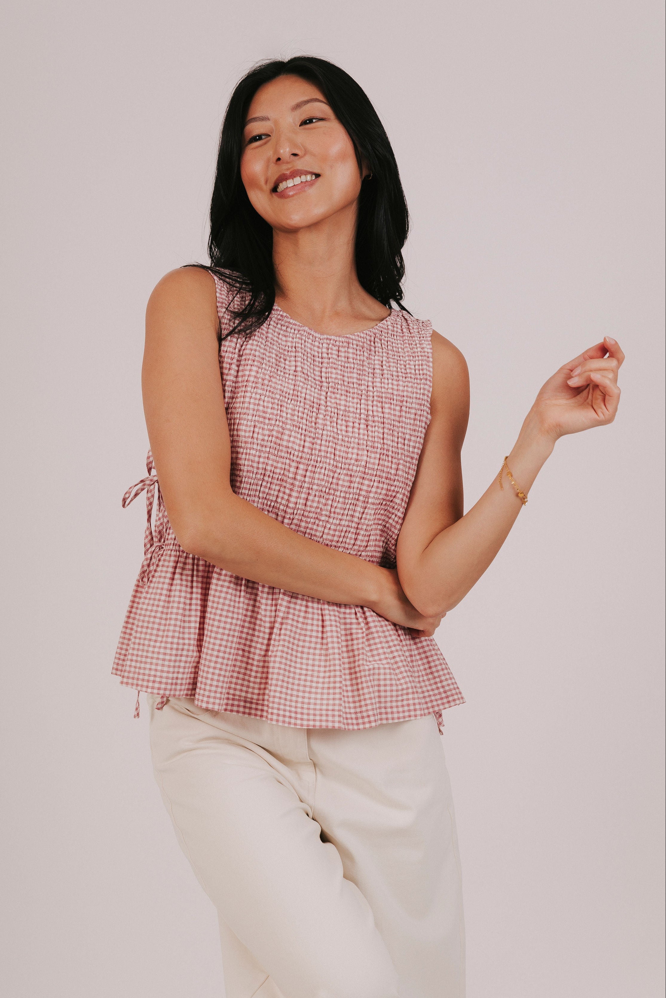 dusty pink gingham smocked ties top model