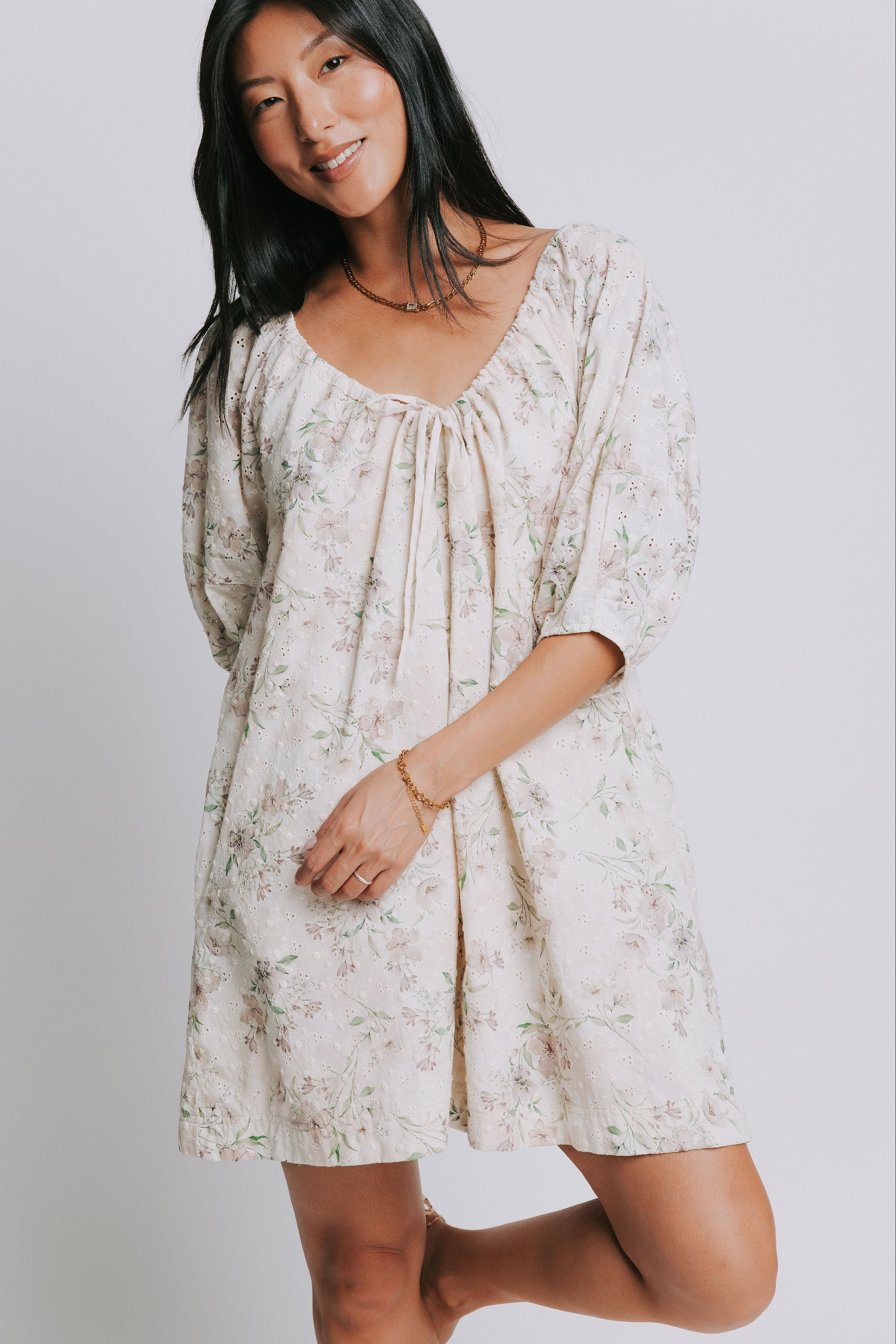 eggshell floral romper with adjustable neckline