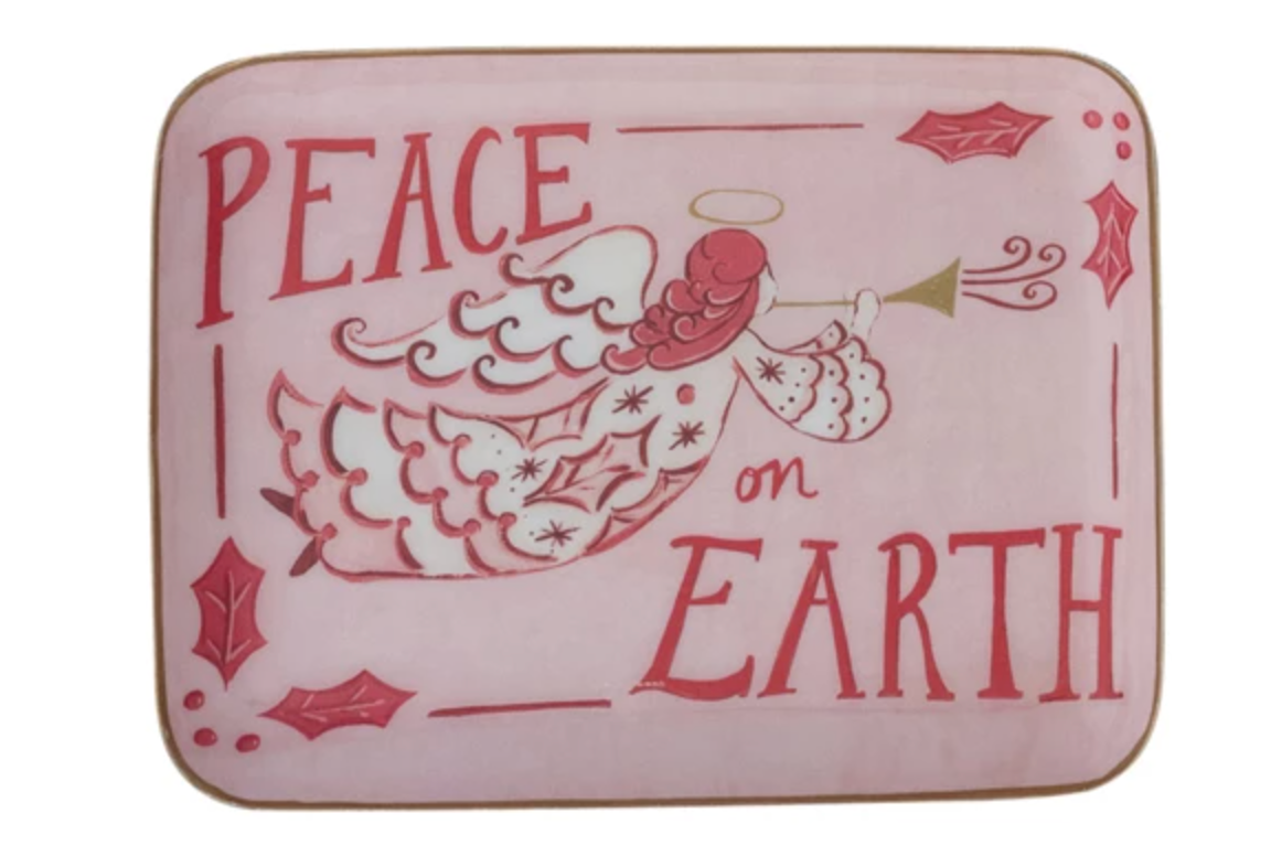Decorative metal tray with angel design and 'Peace on Earth' text on a pink background with gold edge