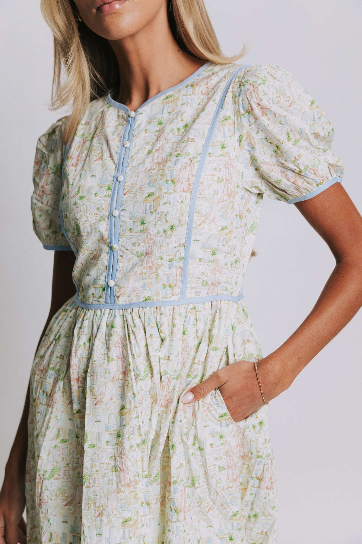 floral midi dress with blue trim and buttons front