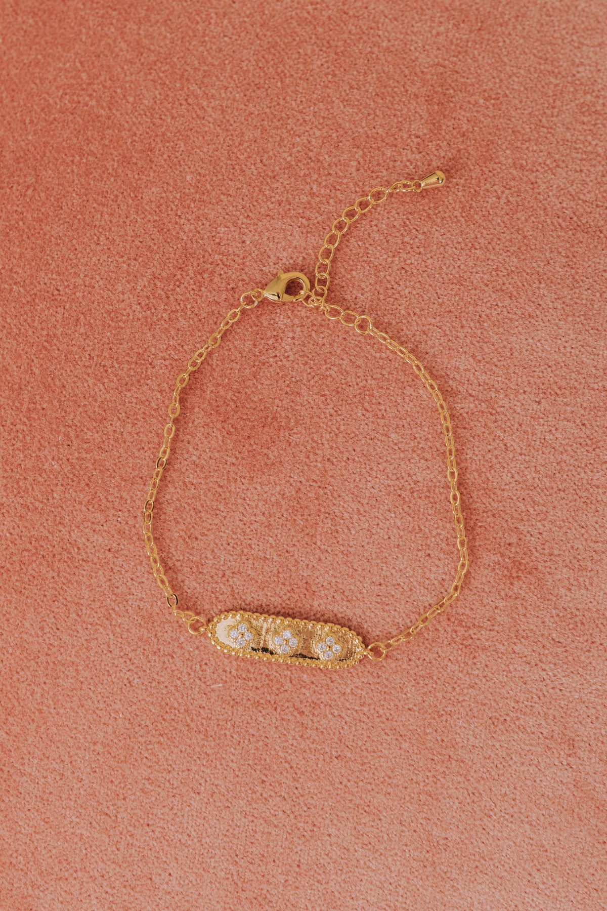 gold 3 rhinestone pendant bracelet flatlay