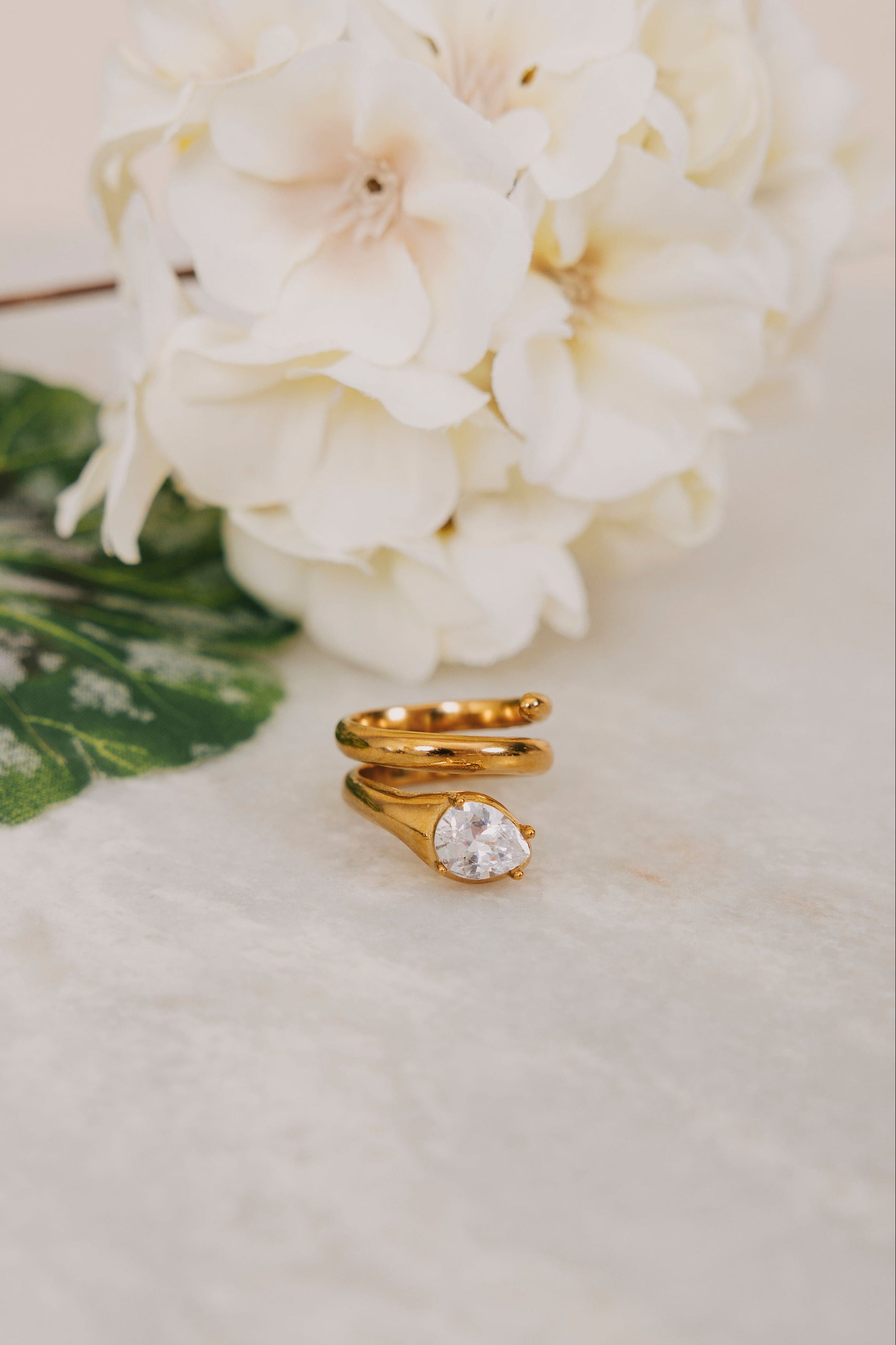 Gold spiral ring with diamond detail