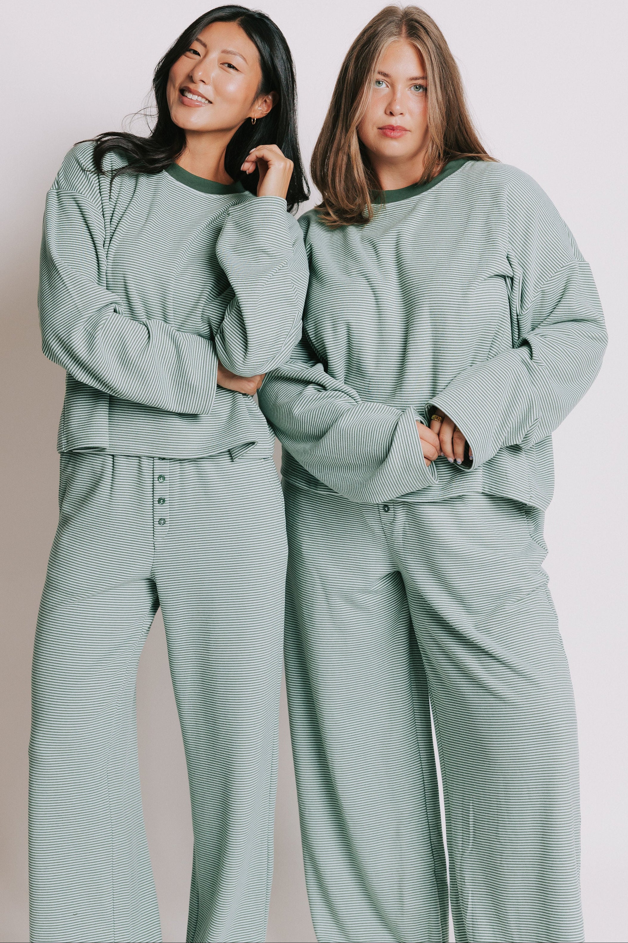 green striped long sleeve top with contrasting neckline models