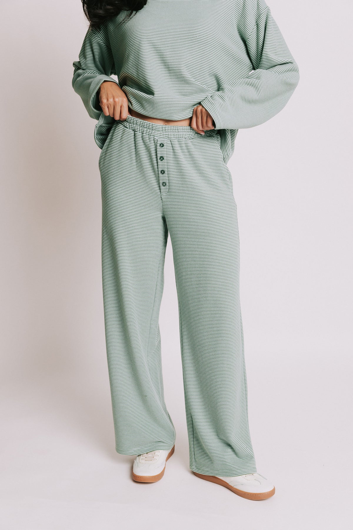 green striped lounge pants with button detail