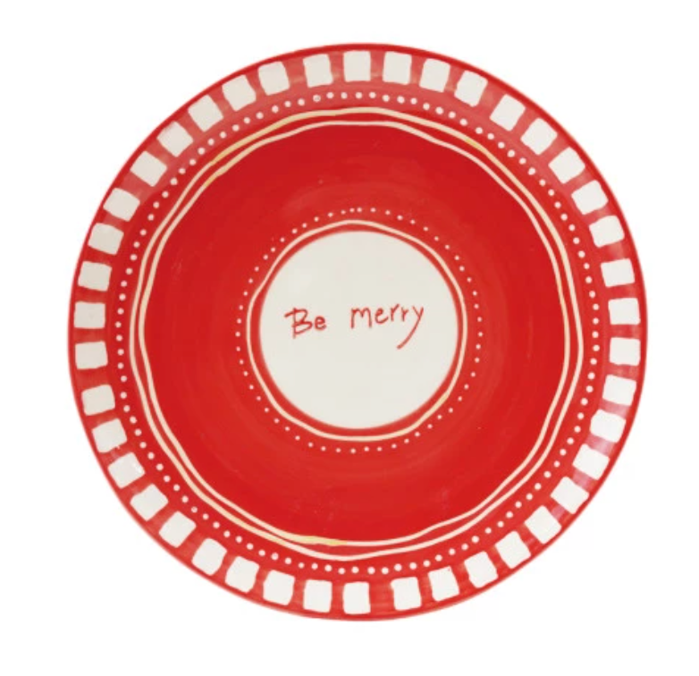 Red plate with white text 'Be Merry' on a white background