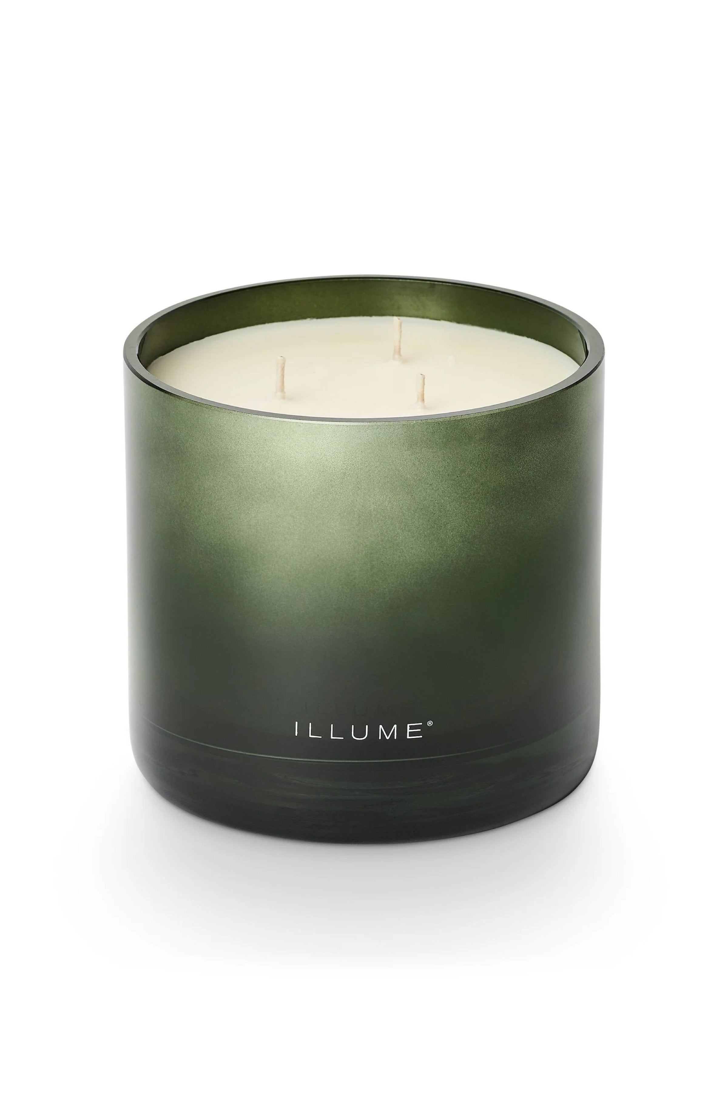 ILLUME - Balsam & Cedar Statement Candle - 20.8 oz in a green glass jar.