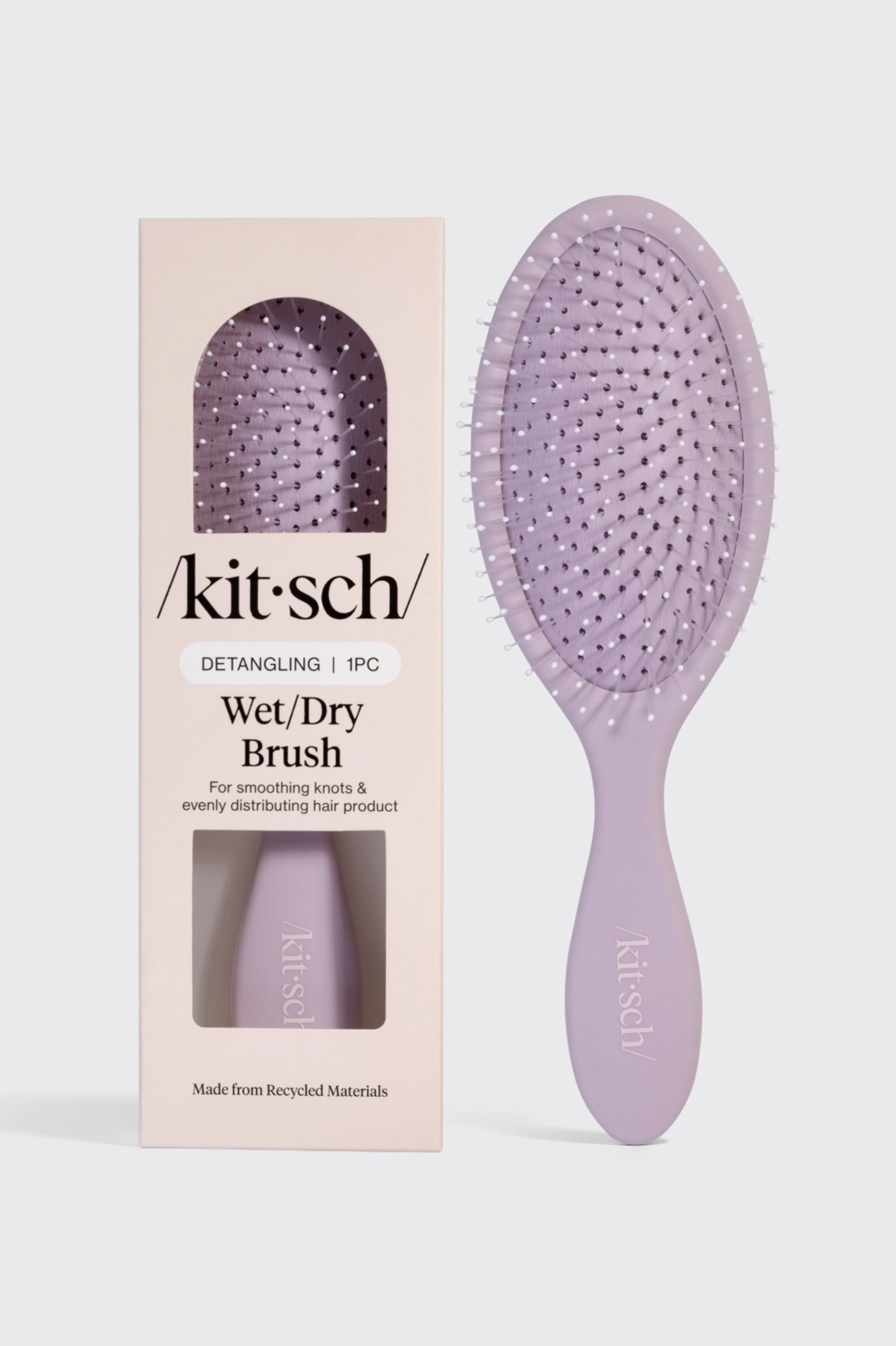 Kitsch recycled plastic detangling brush for wet/dry hair. For smoothing knots and evenly distributing hair product.