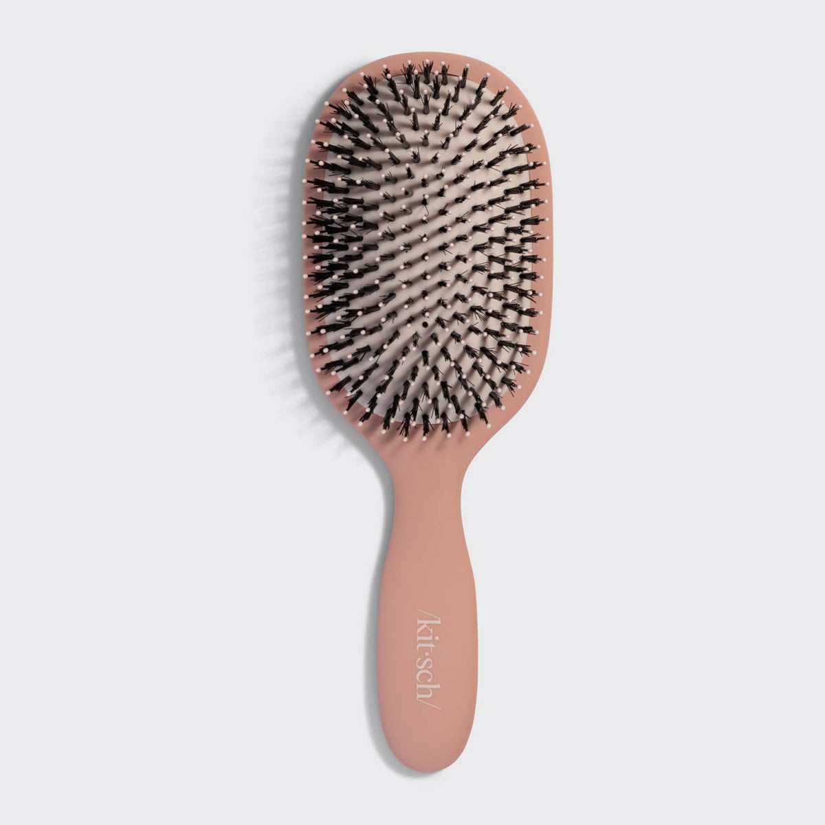 Kitsch recycled plastic shine boosting smooth and polish brush in terracotta. For enhancing the hair's natural shine.