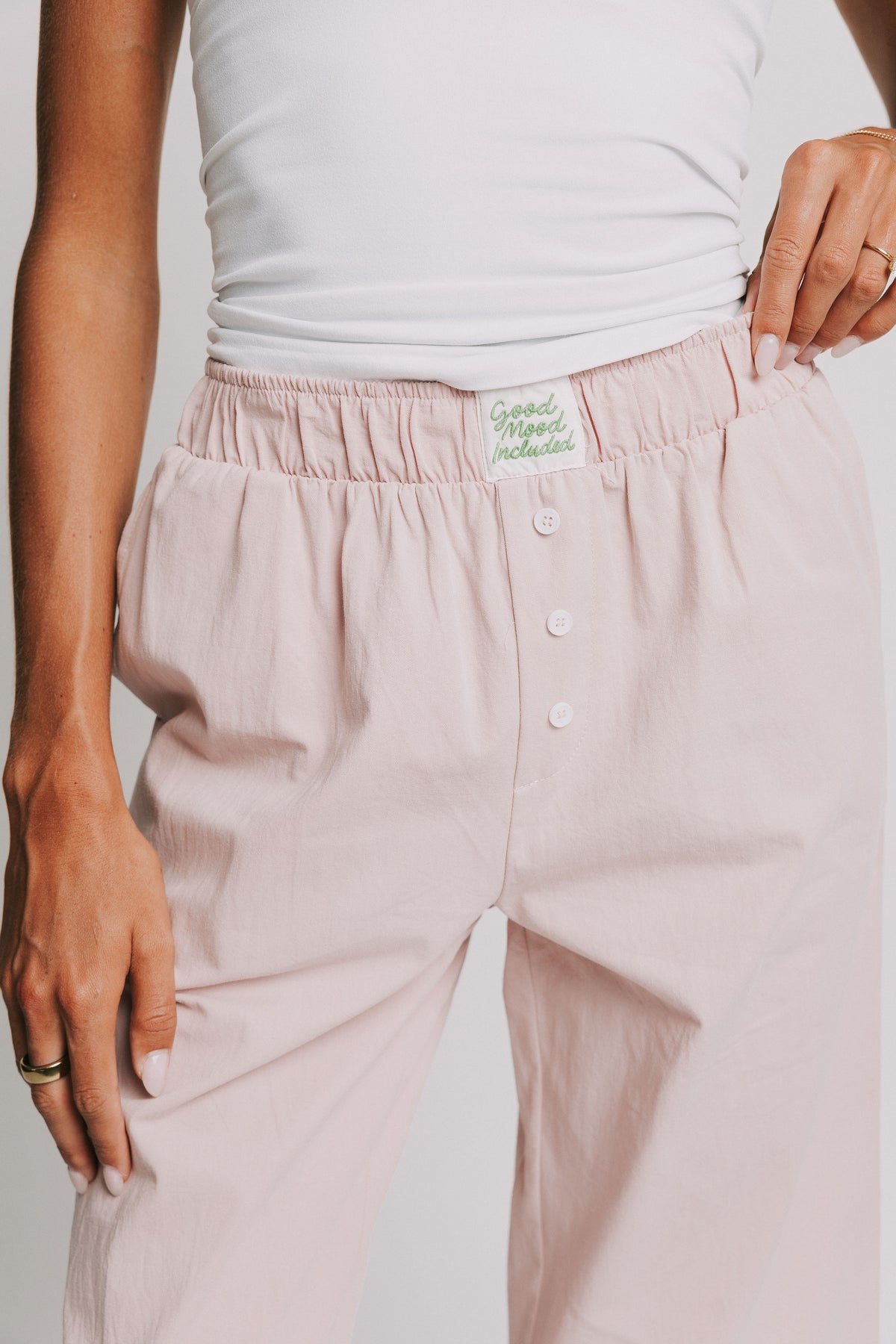 mauve pants with elastic waistband and buttons