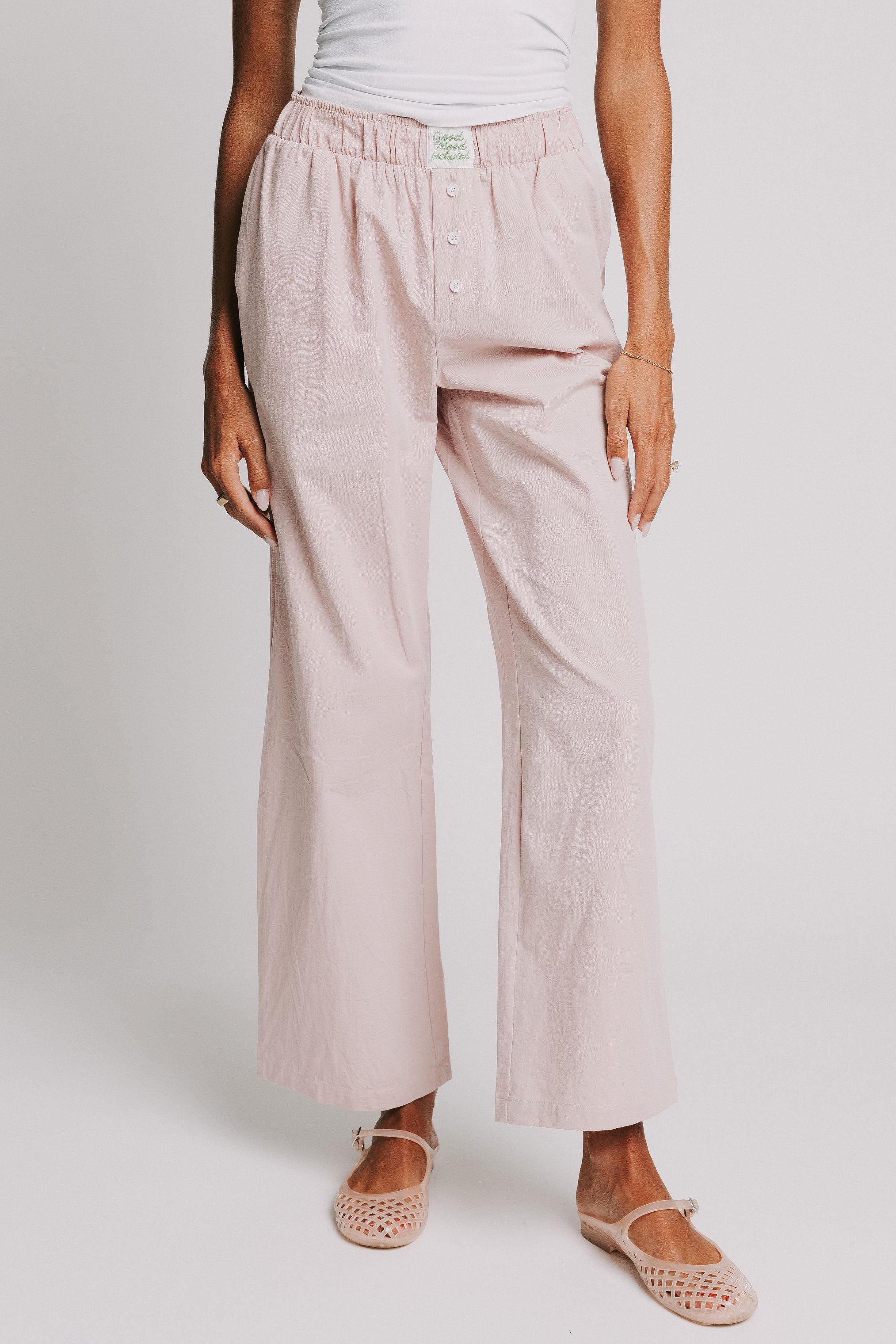 mauve pants with elastic waistband and buttons