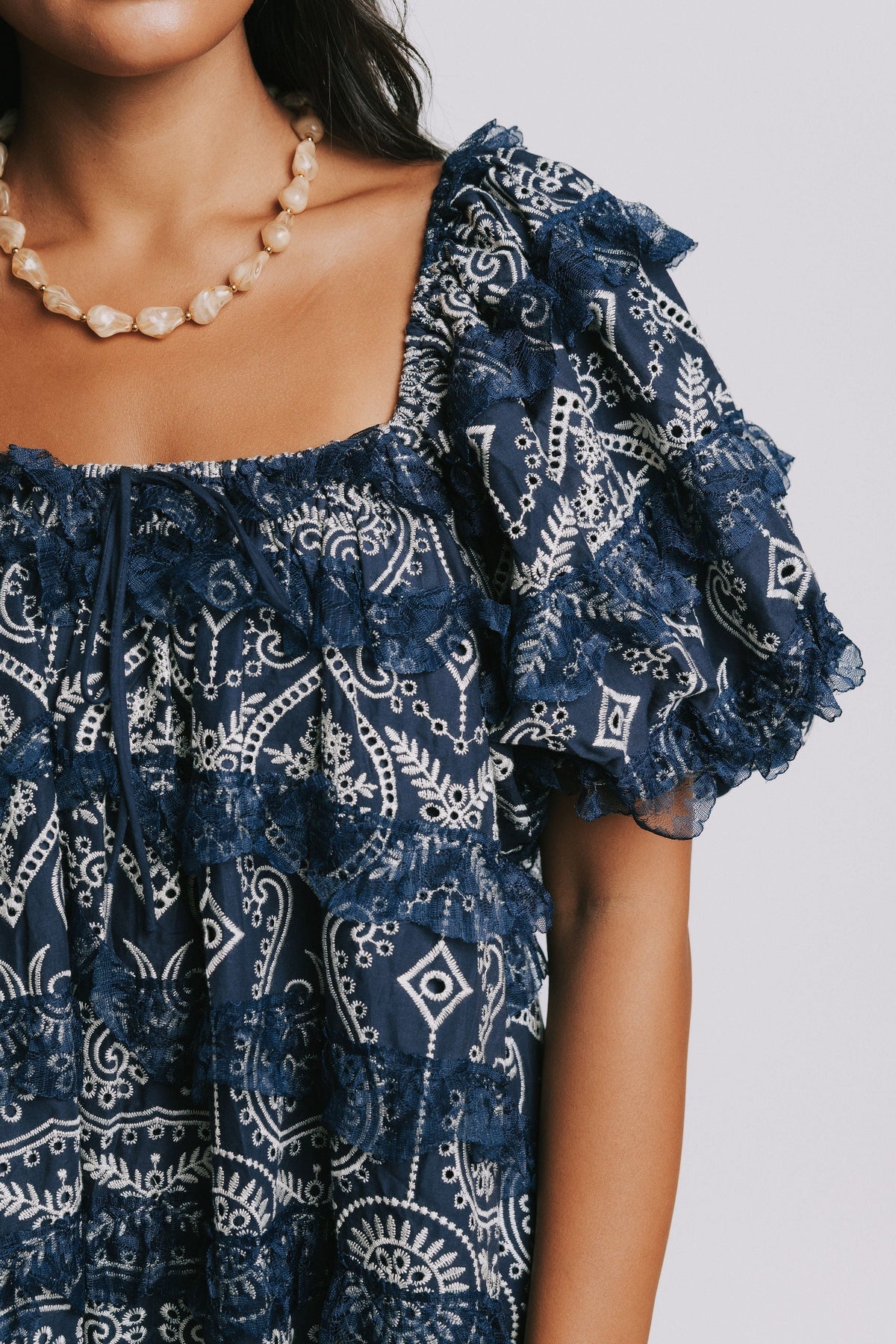navy and white embroidered mini dress close