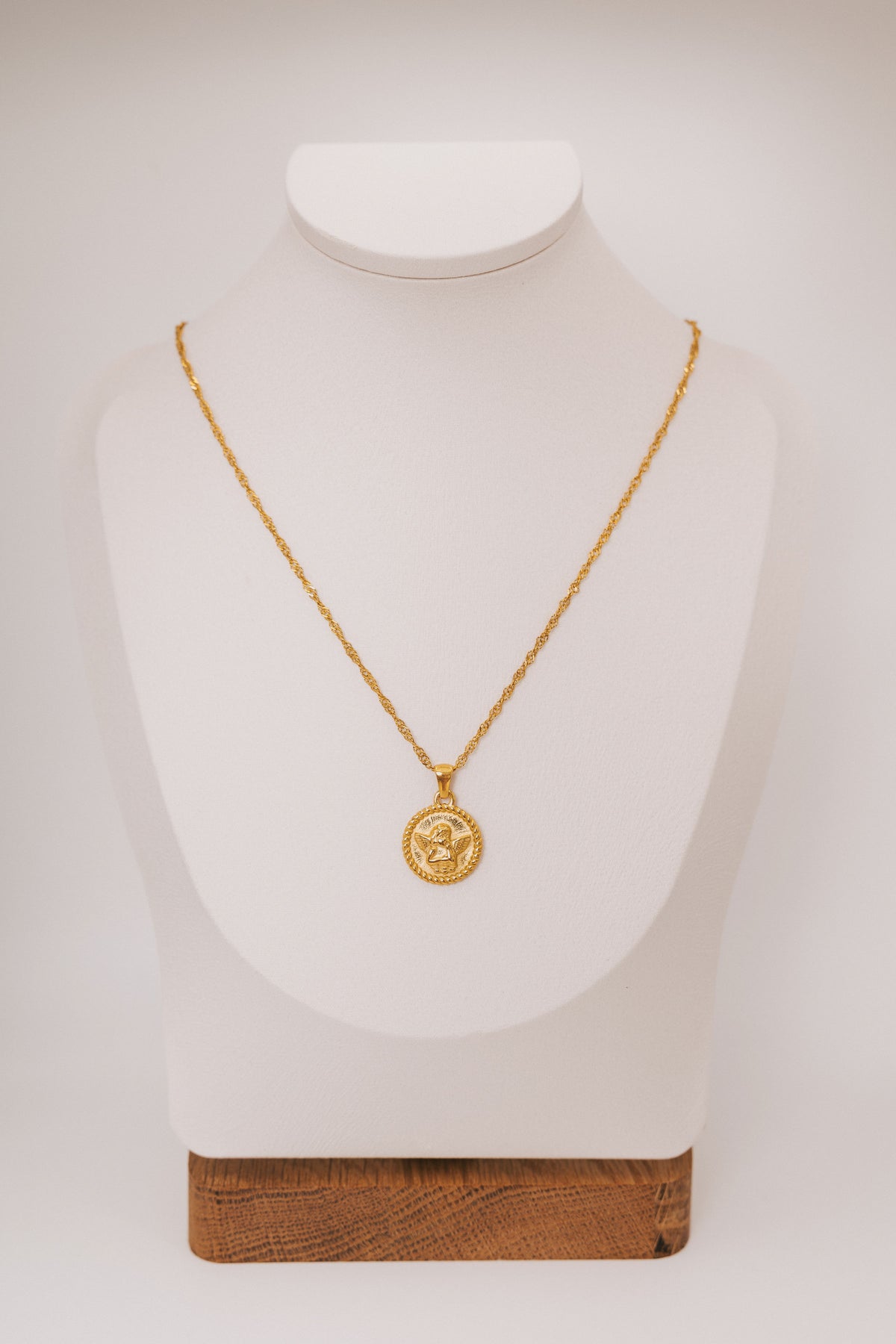 necklace with circular angel pendant