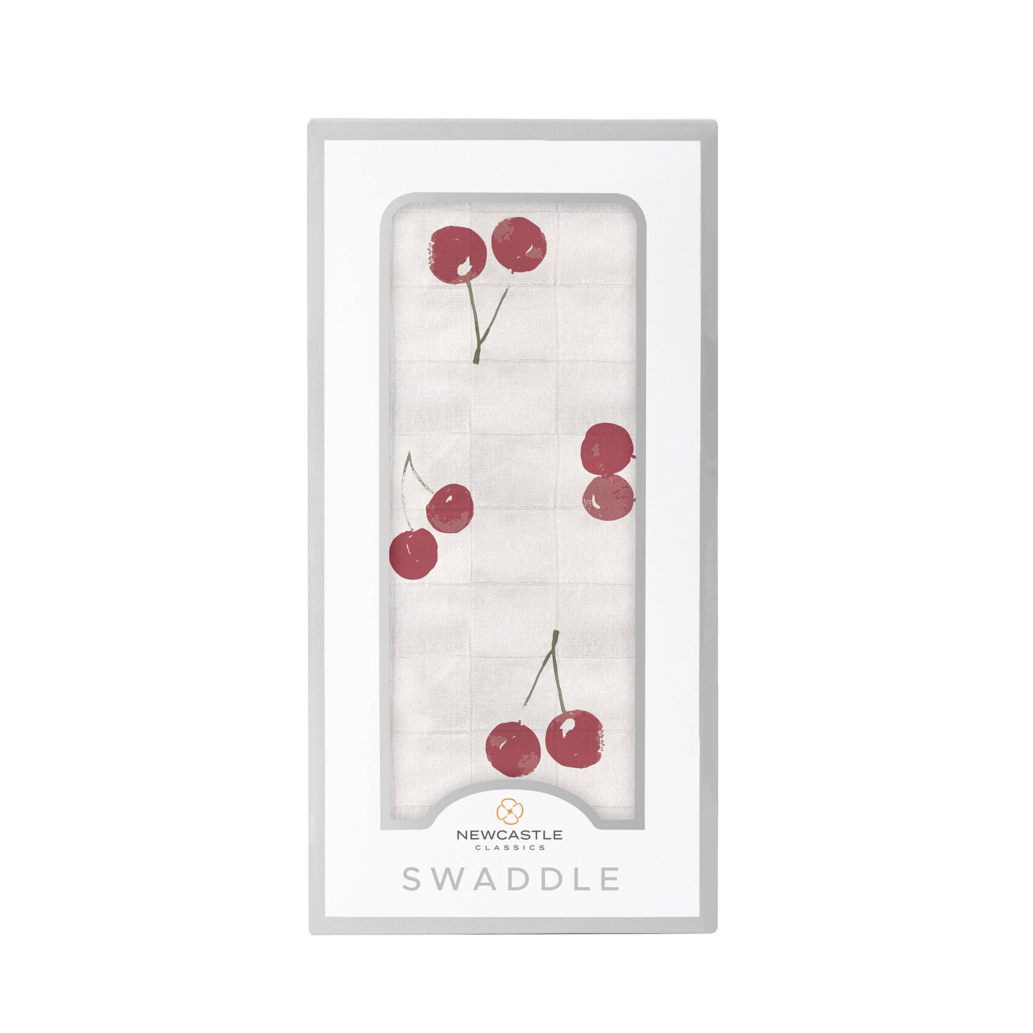 white baby swaddle with cherry pattern by newcastle classics