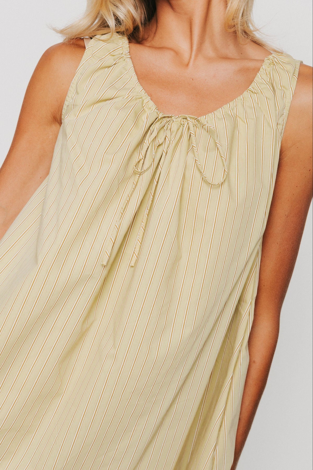 olive striped mini dress with tie at the neckline front