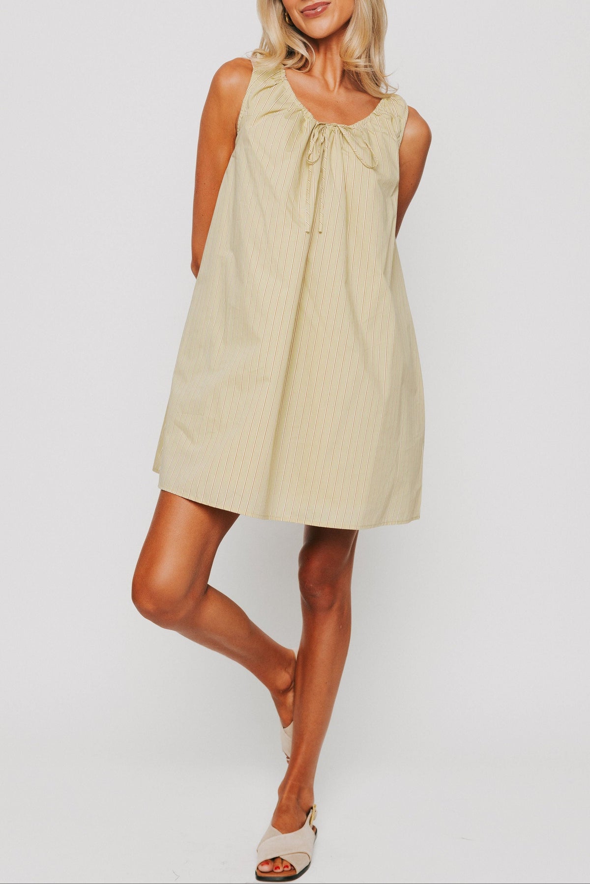 olive striped mini dress with tie at the neckline