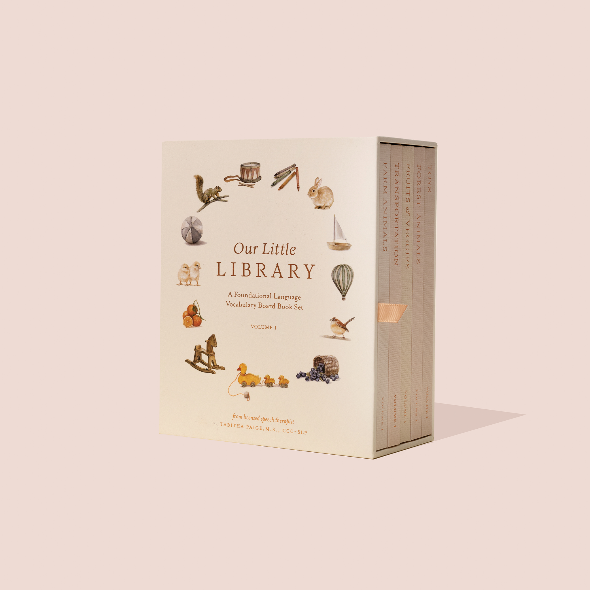 A hardcover box set of board books titled 'Our Little Library' with illustrations of various animals, fruits, vegetables, and objects.