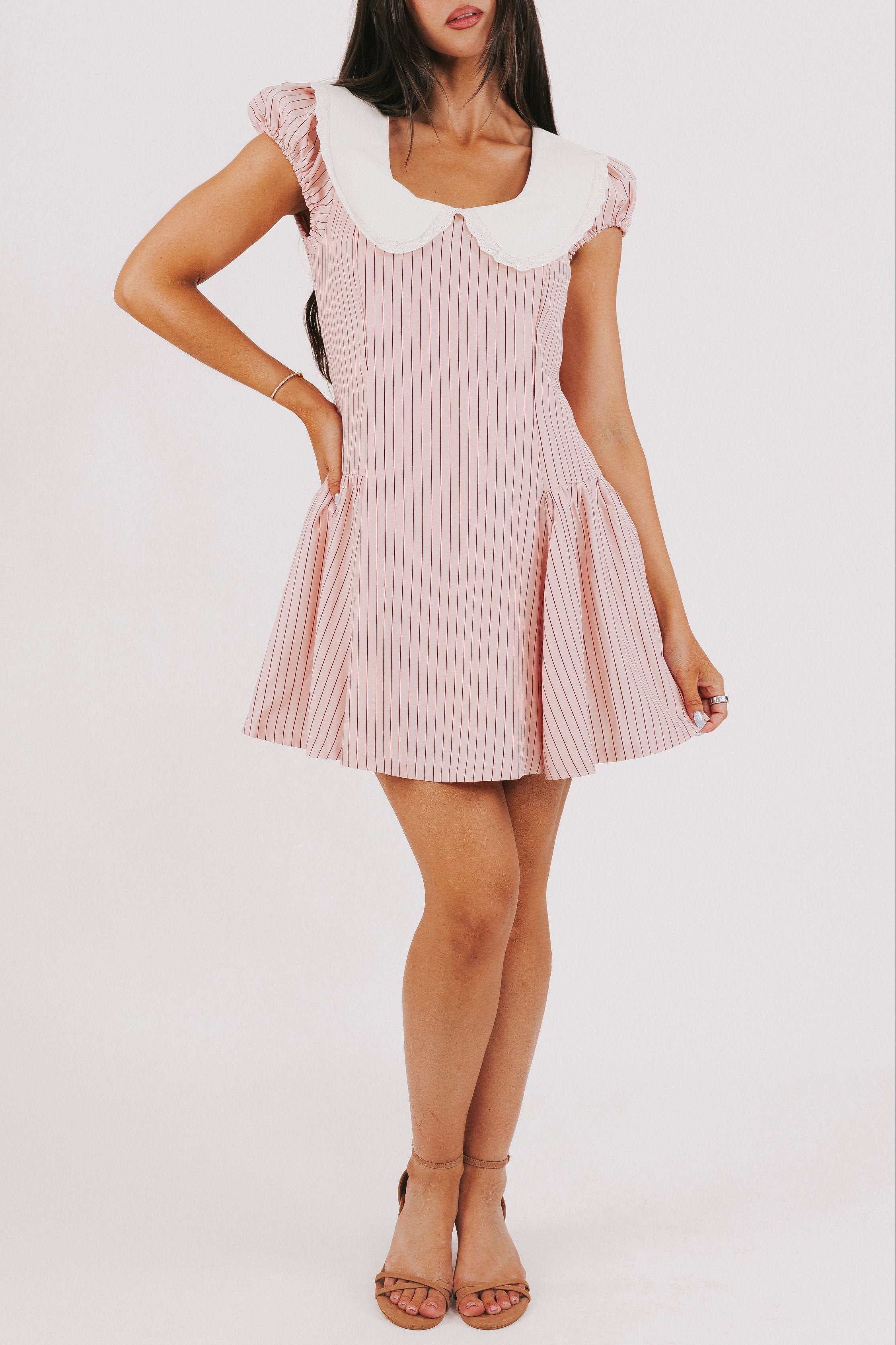 pink striped mini dress with white collar and puff sleeves