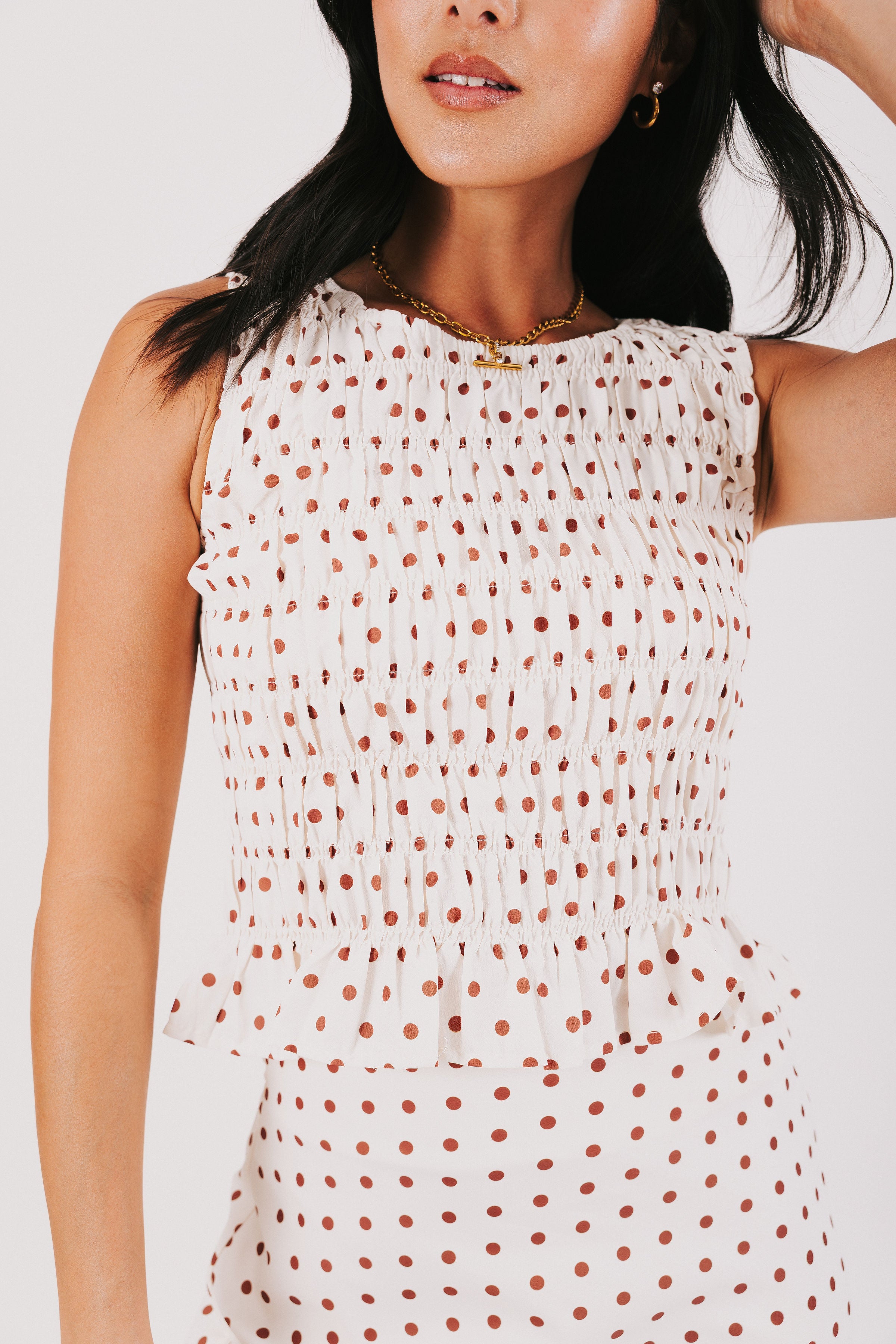 polka dot gathered tank with ruffled hem