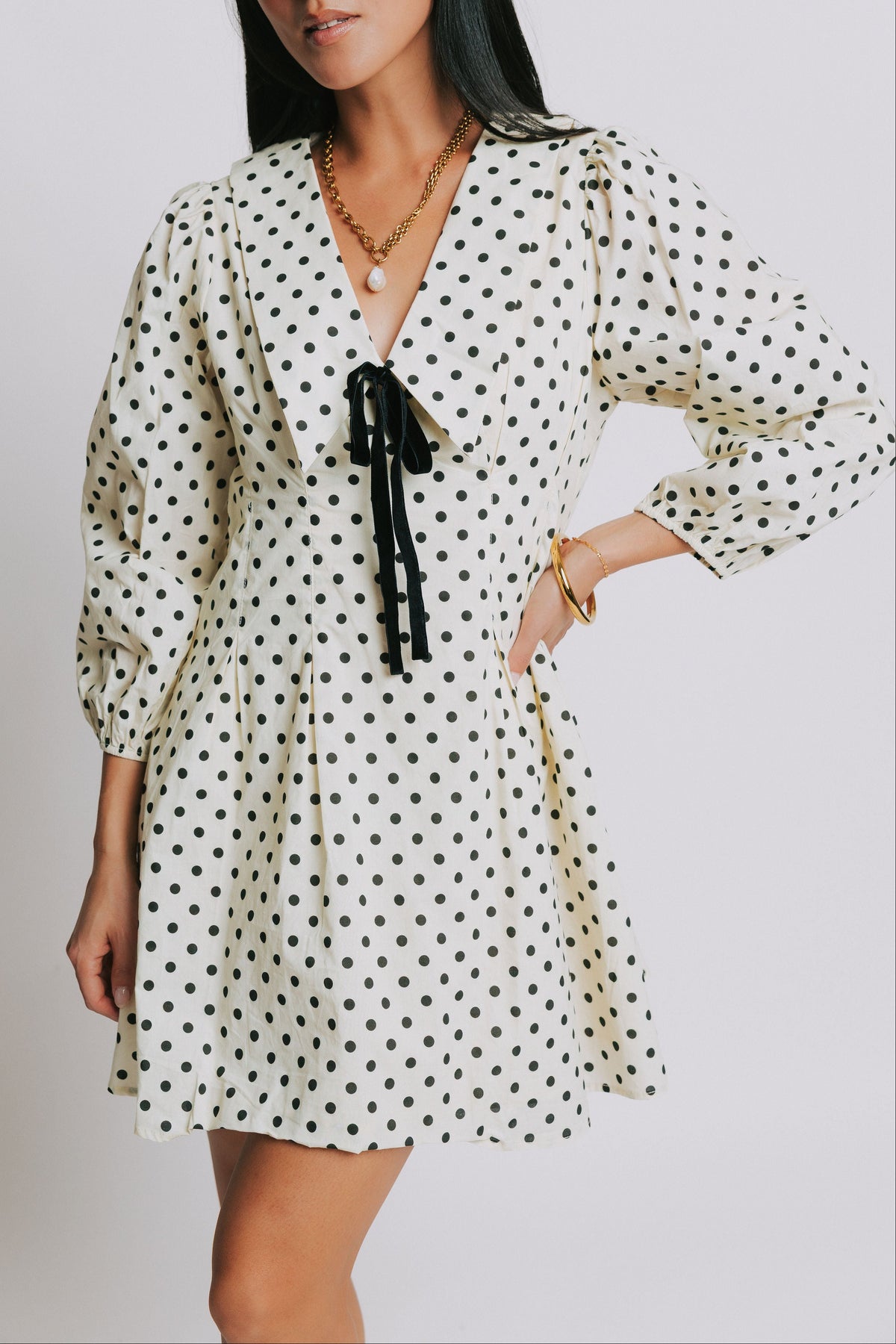 polka dot mini dress with v neck and long puff sleeves front