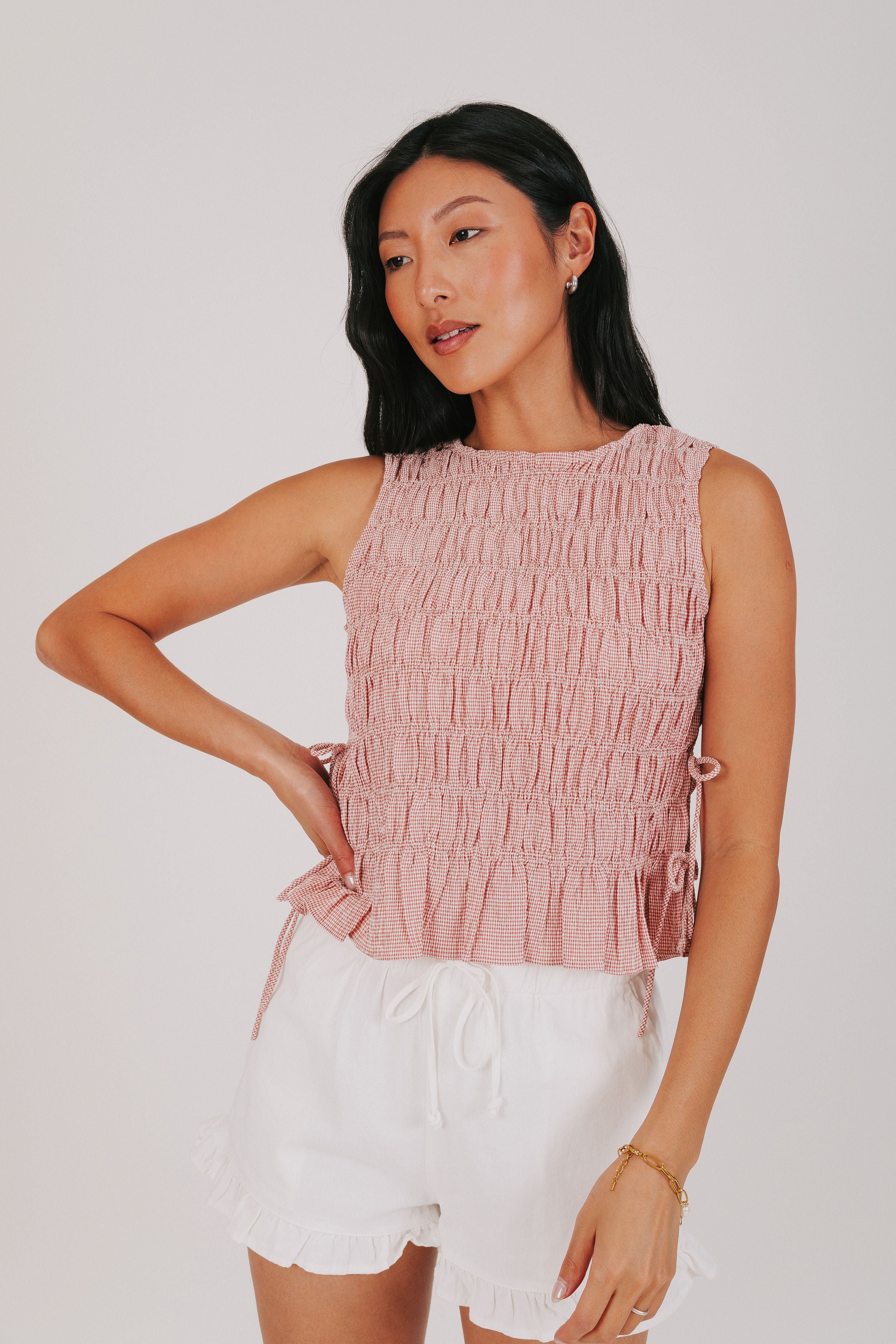 red smocked tank with bows on the side