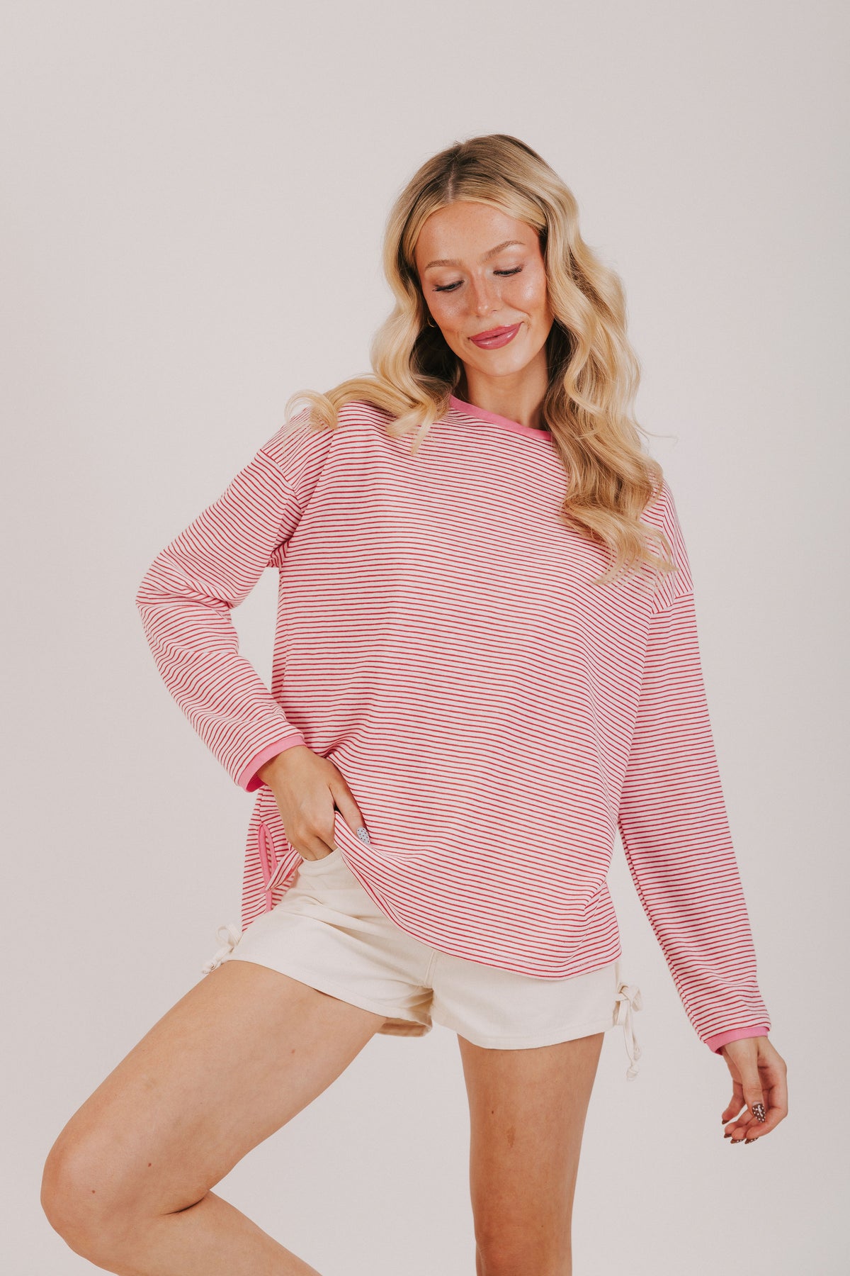 Red and white striped long sleeve tee with pink trim