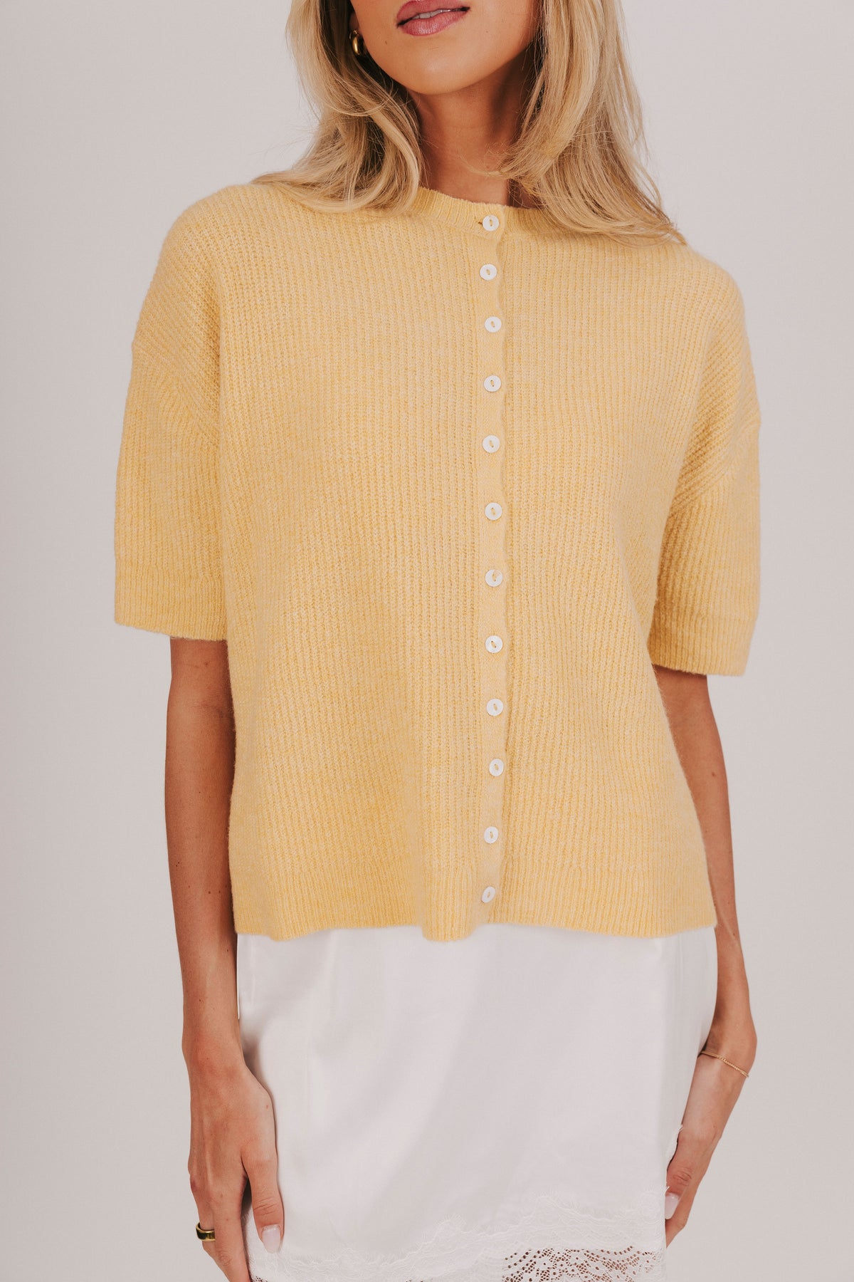 ribbed yellow knit button top detail