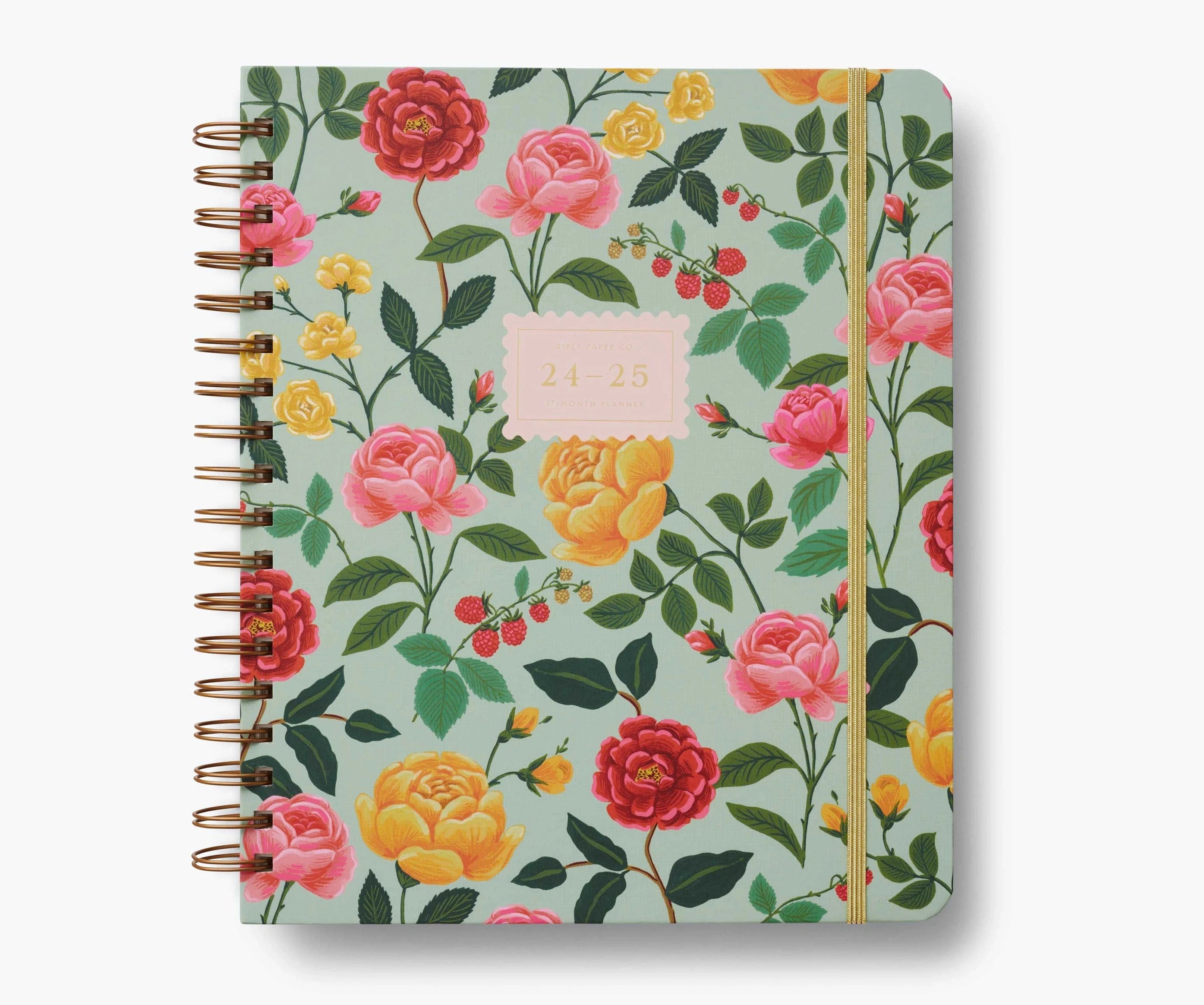 Floral patterned planner notebook with a gold spiral binding
