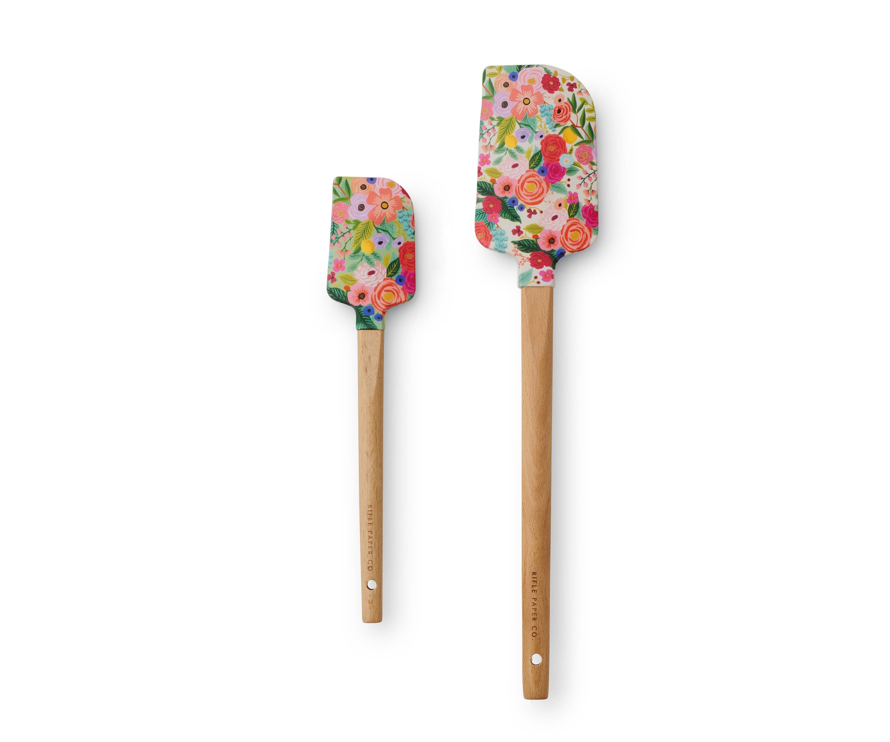 Two floral-patterned spatulas with wooden handles