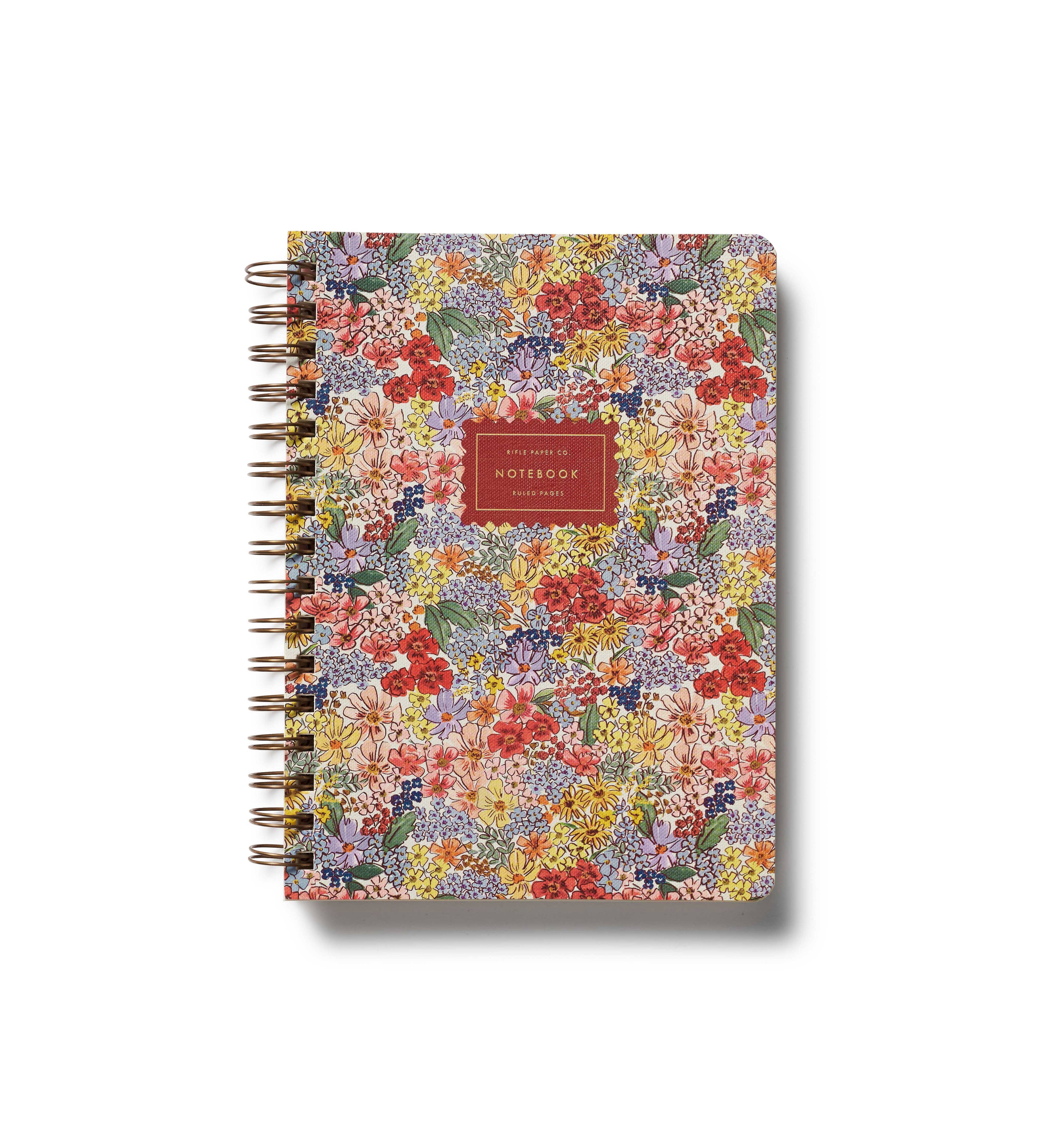 Floral patterned notebook with a red label on a white background