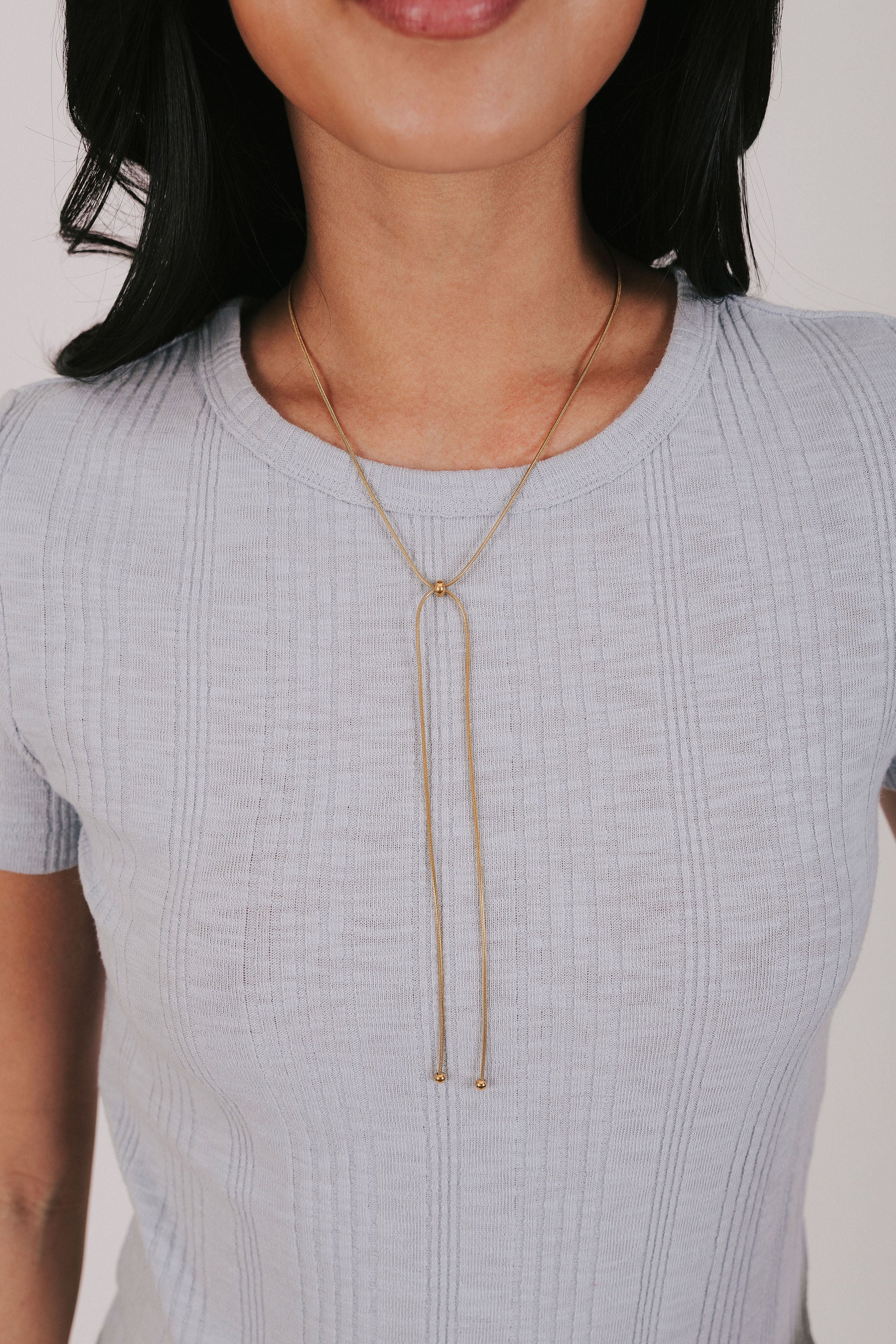 Gold plated snake chain necklace that's slider style with ball bead accents