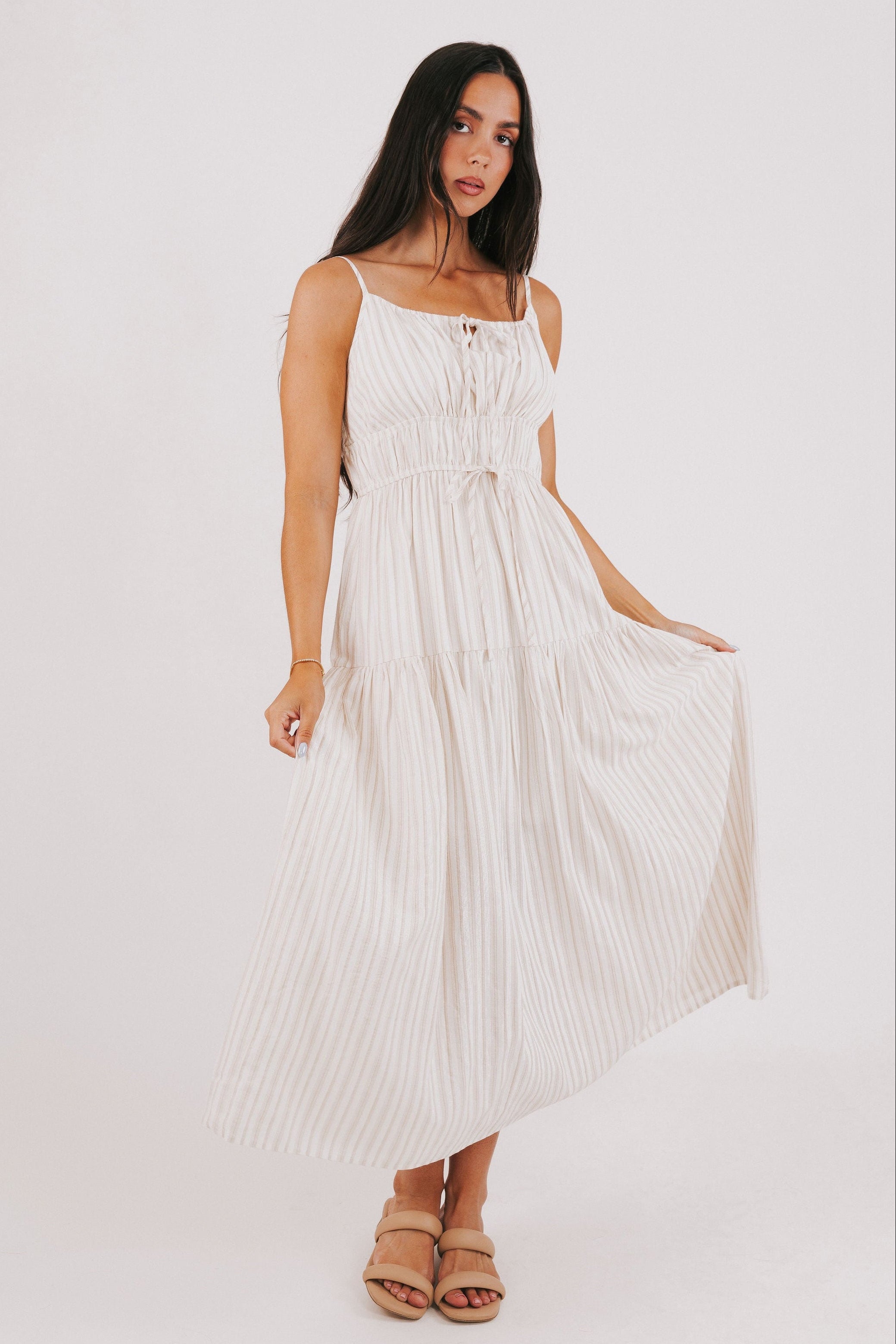 tan striped maxi dress with bow at the waist