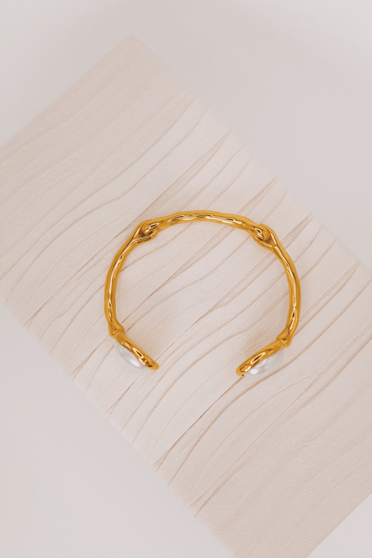 textured gold bracelet with pearl accents top